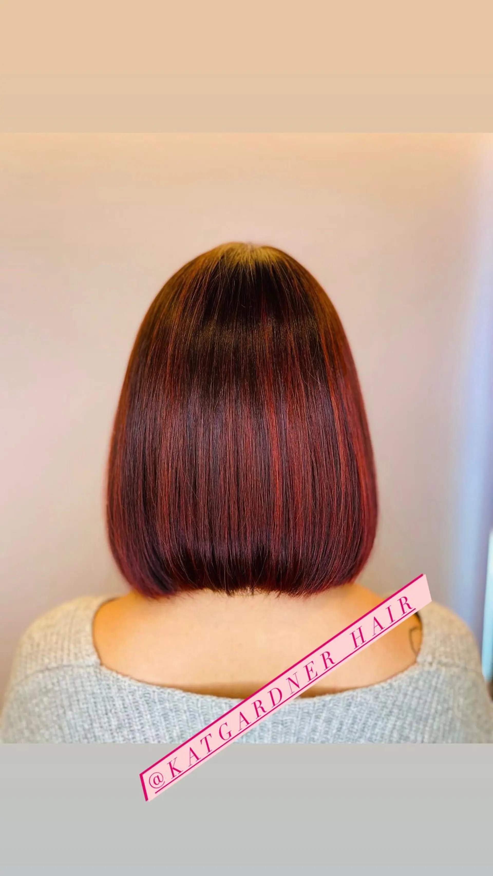 A sleek, chin-length bob with subtle highlights. 1