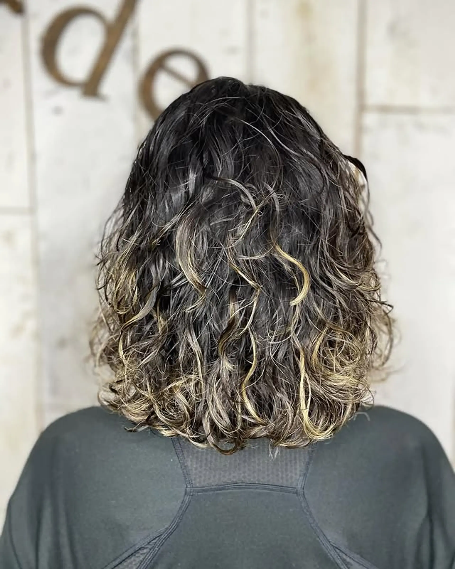 A wavy lob with an ombre color effect, and textured ends. 1