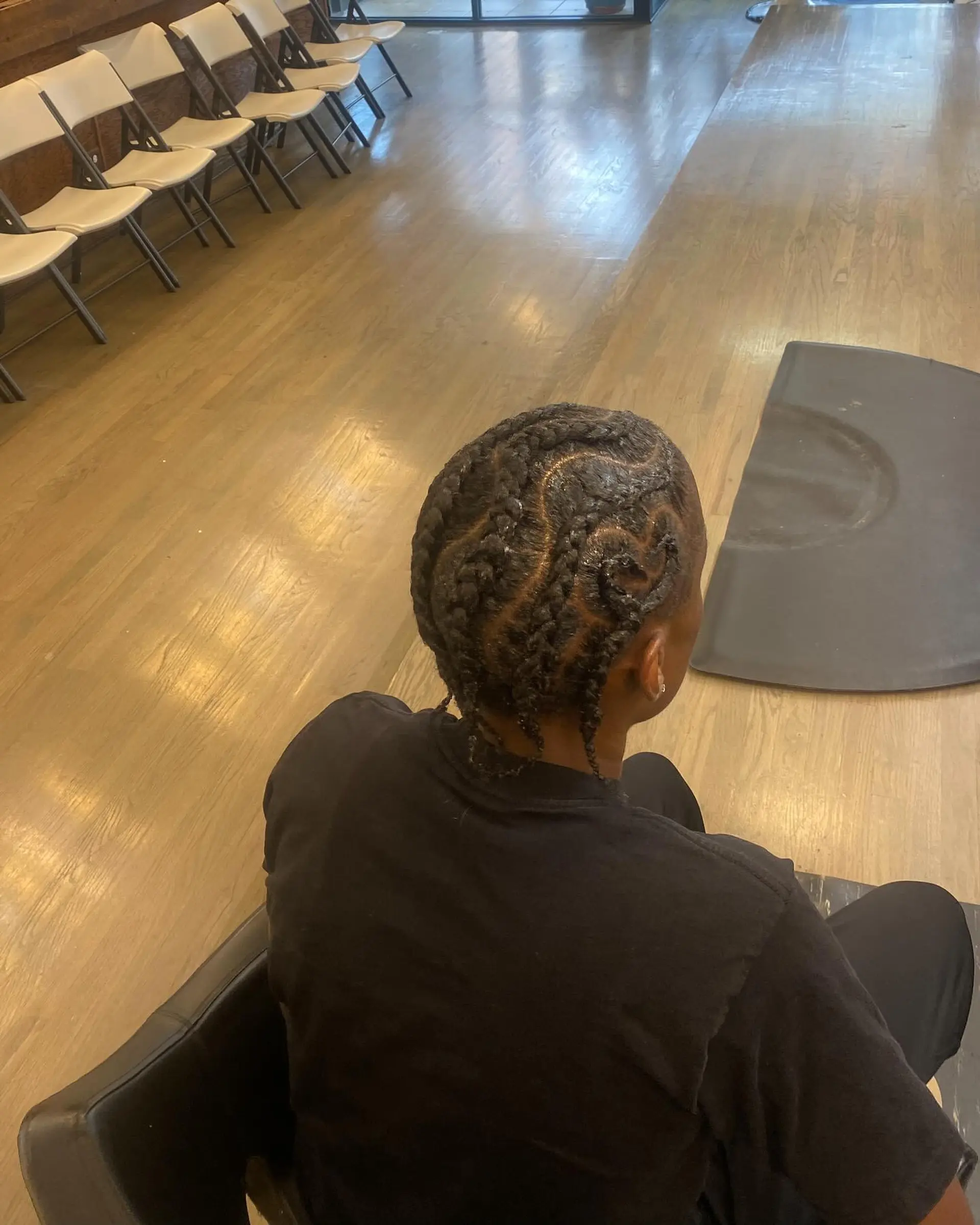 A stylish cornrow design that provides a protective style and showcases a unique braided pattern. 1