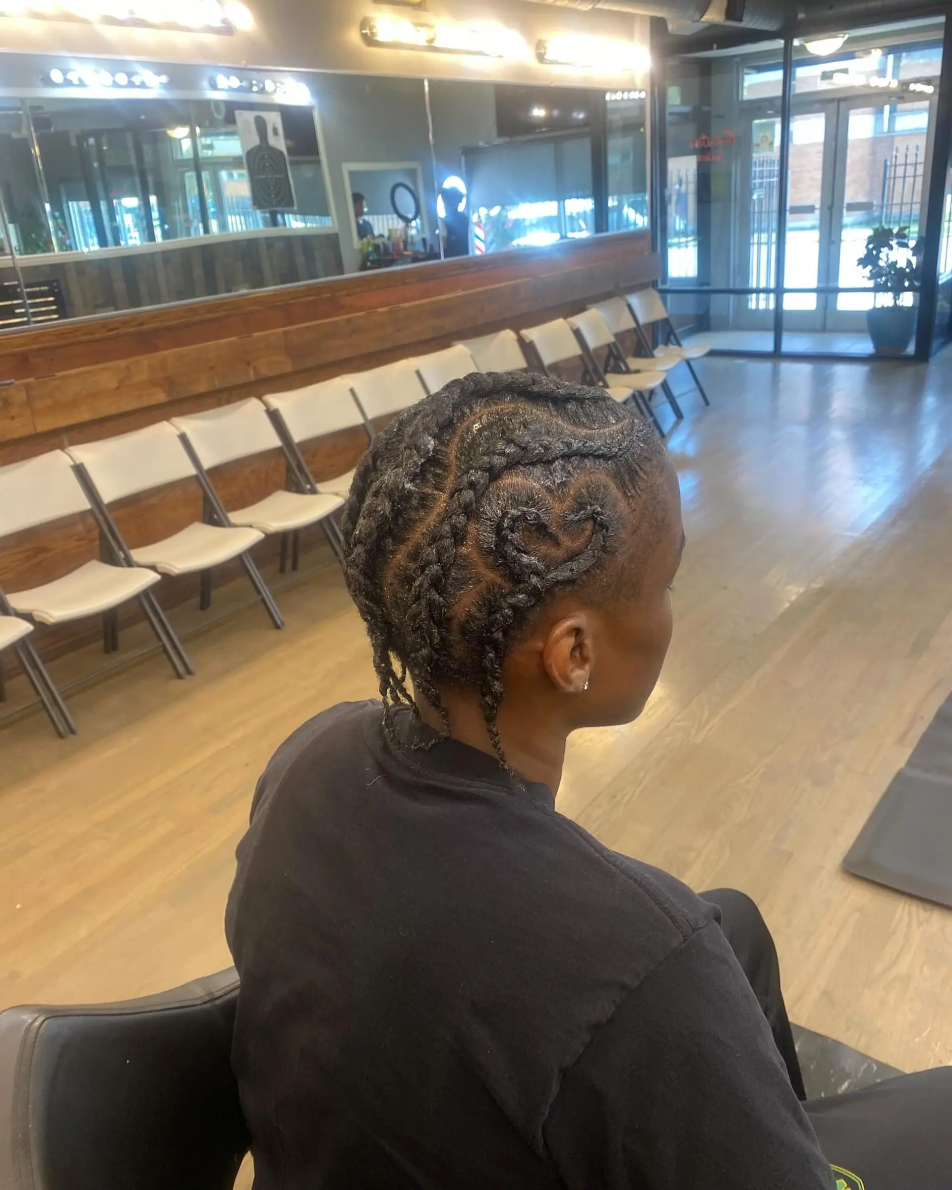 A stylish cornrow design that provides a protective style and showcases a unique braided pattern. 2