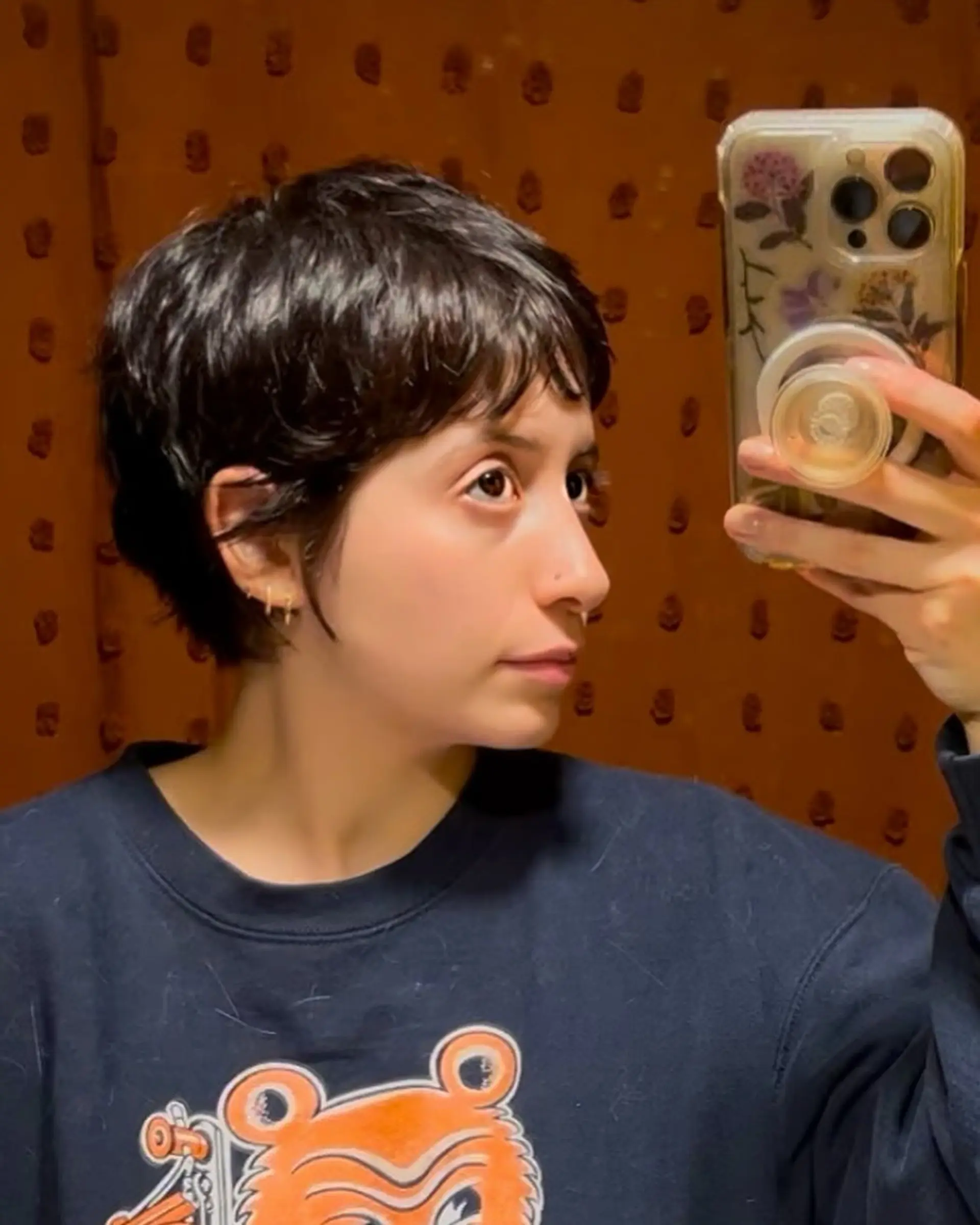 A short, textured pixie cut with a slightly edgy feel. 1