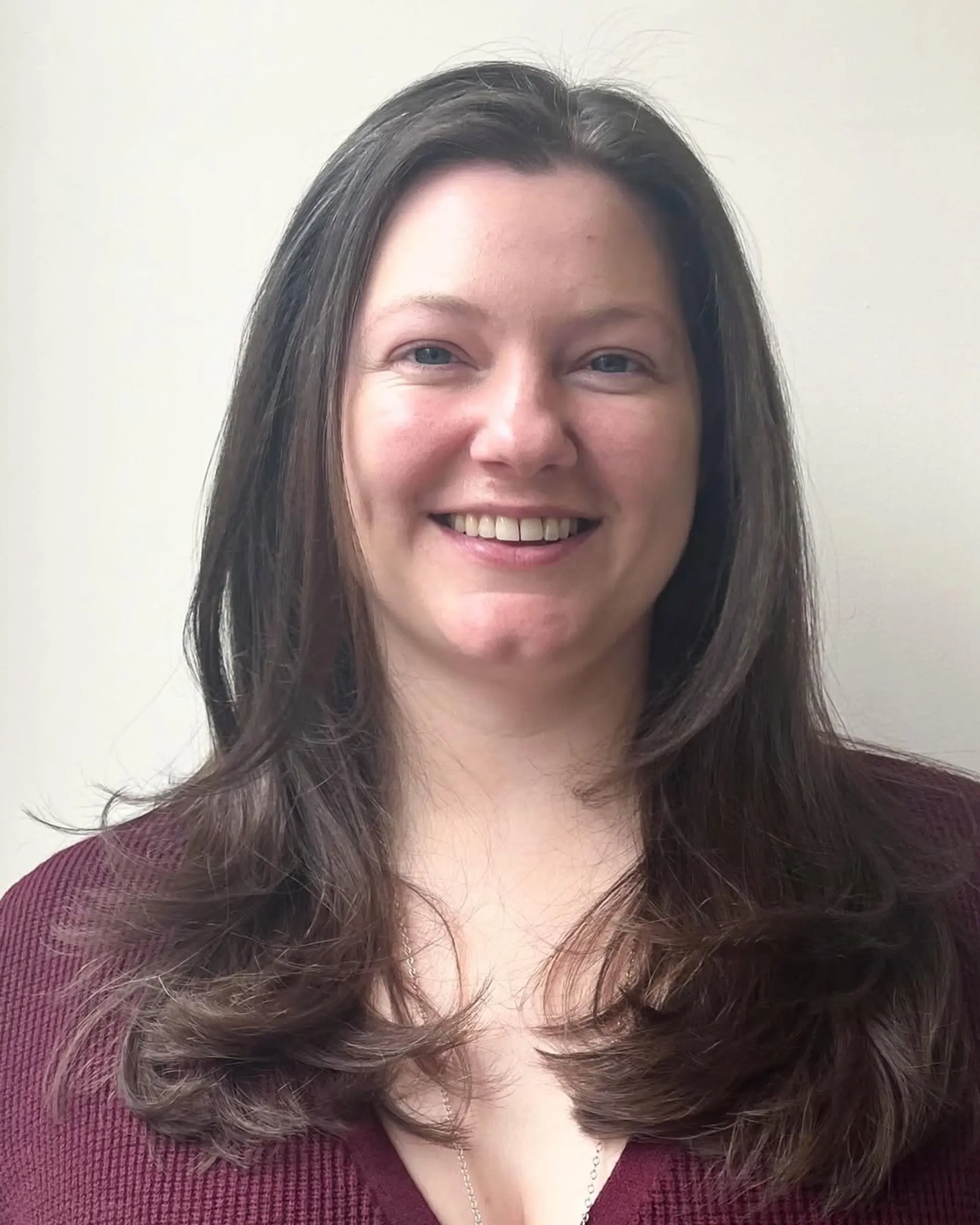 A long, layered style with face-framing layers, natural shine, and a soft under-curl. 1