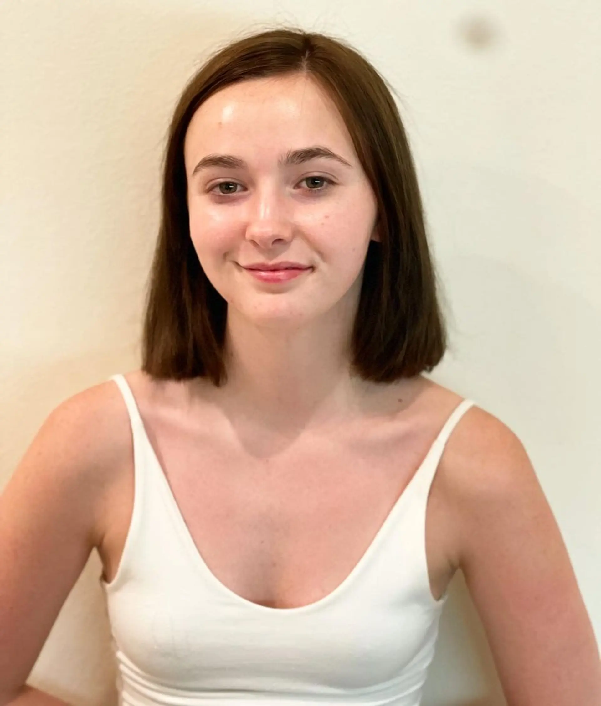 A classic blunt bob haircut with a straight, even length around the chin. 1