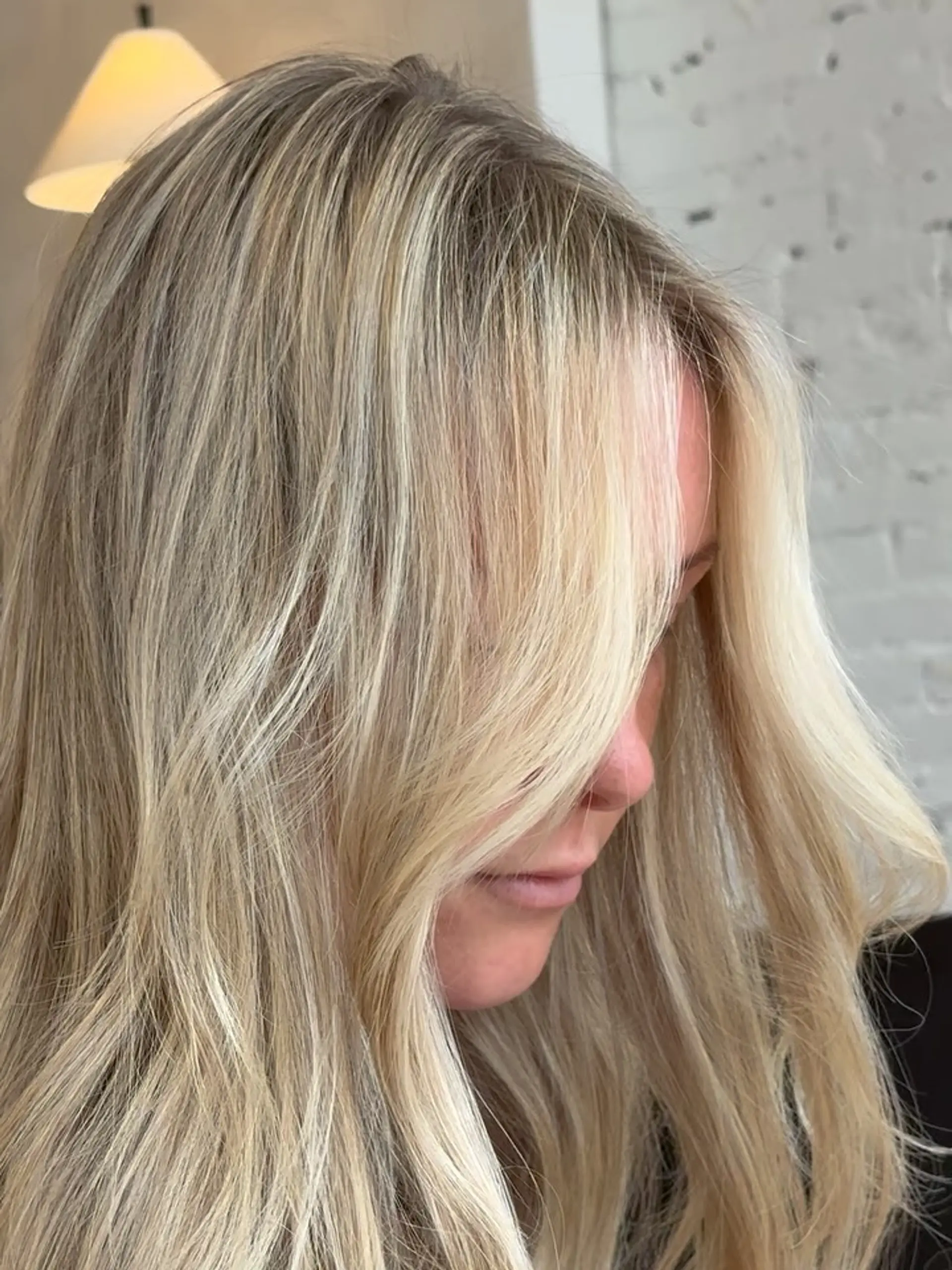 Long dimensional blonde hair featuring bright, finely blended highlights and illuminated face-framing layers. 1