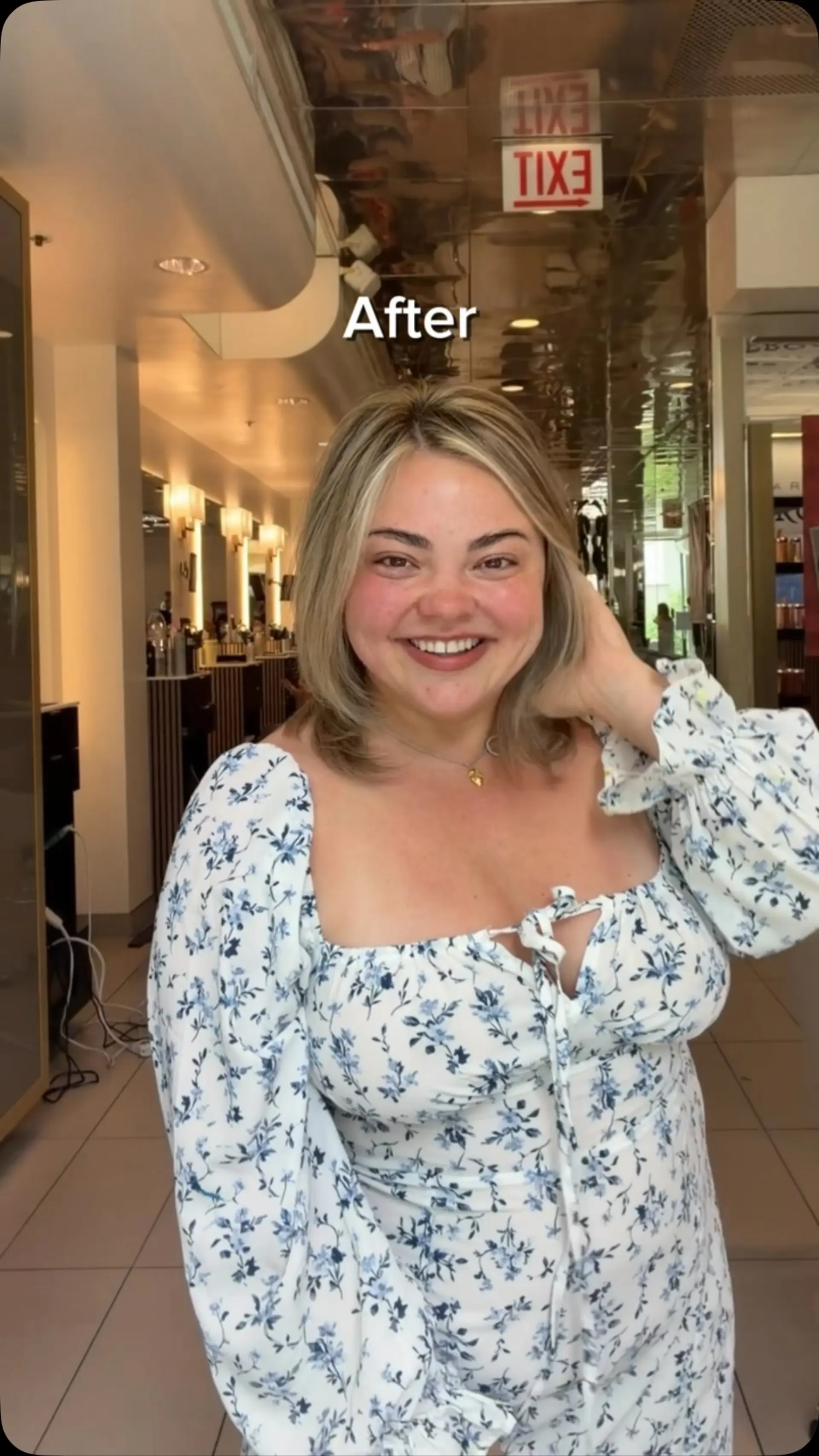 A textured, shoulder-length layered lob featuring dimensional blonde highlights and a smooth blowout with subtly curved ends. 1