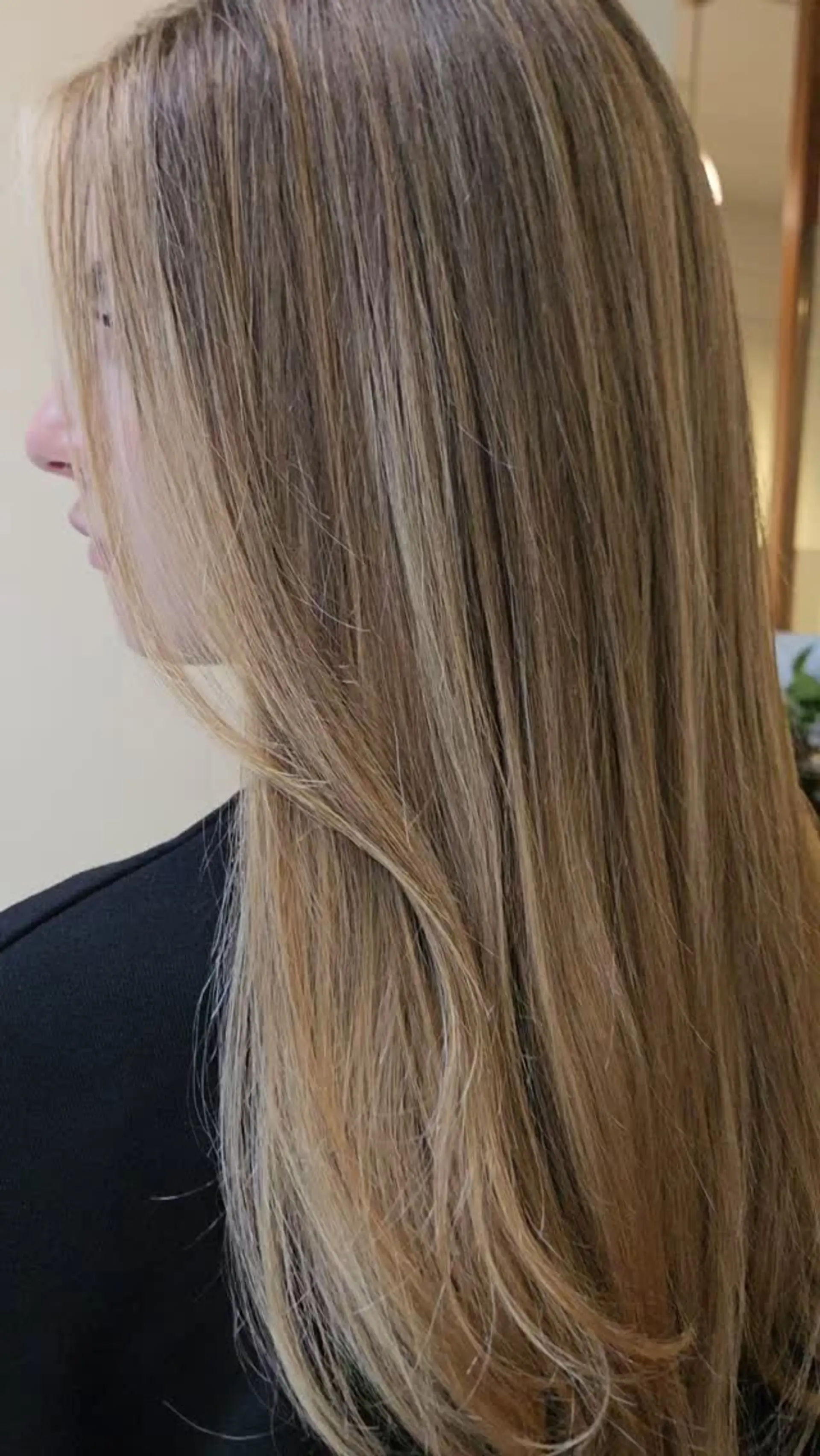 Straight, smooth long hair featuring seamless warm honey blonde balayage highlights blended through a natural base. 1