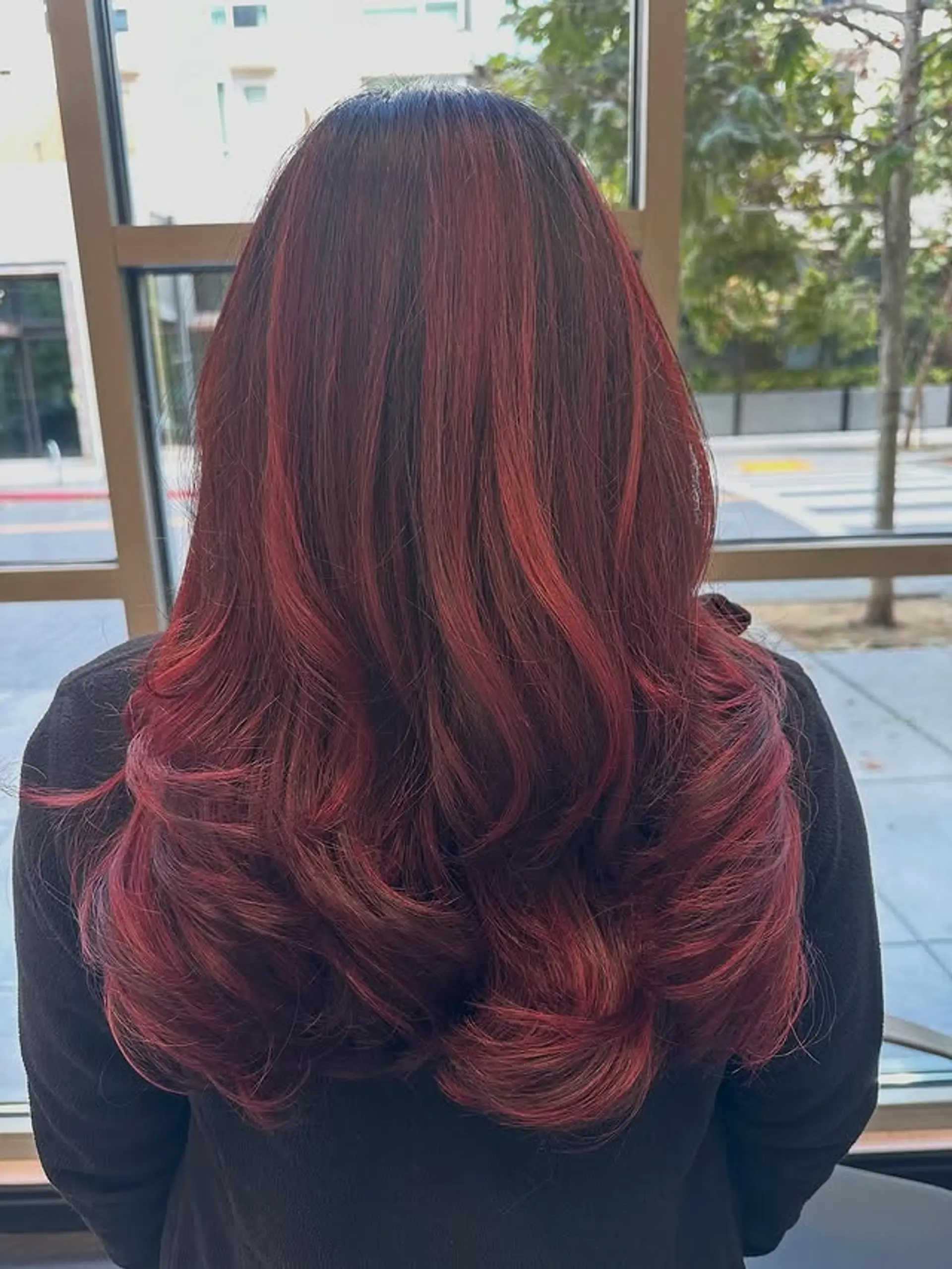 Long, layered waves with a rich, dimensional red color. 1