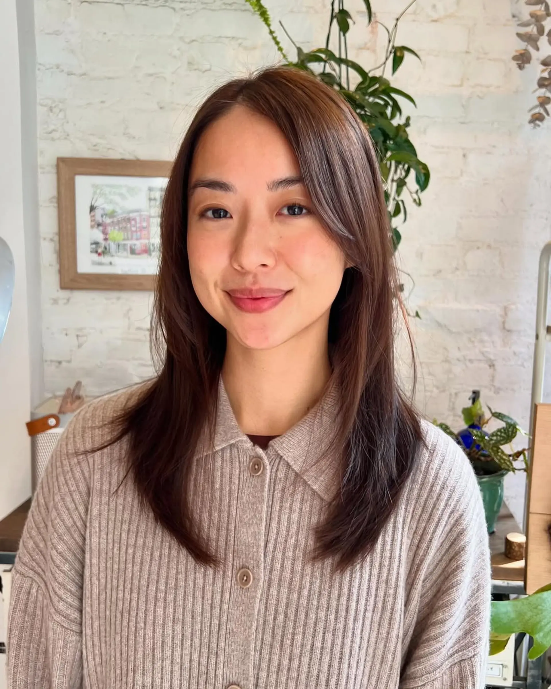 A medium-length layered cut with face-framing layers. 1