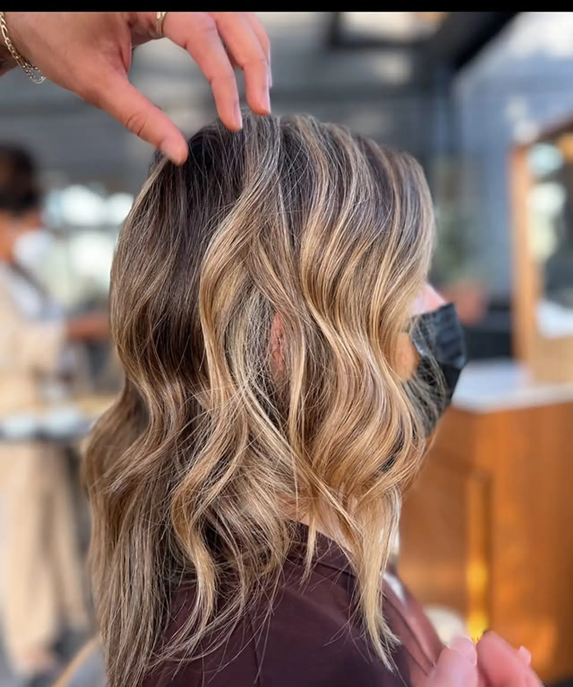 A bronde balayage with soft waves and shoulder length. 1