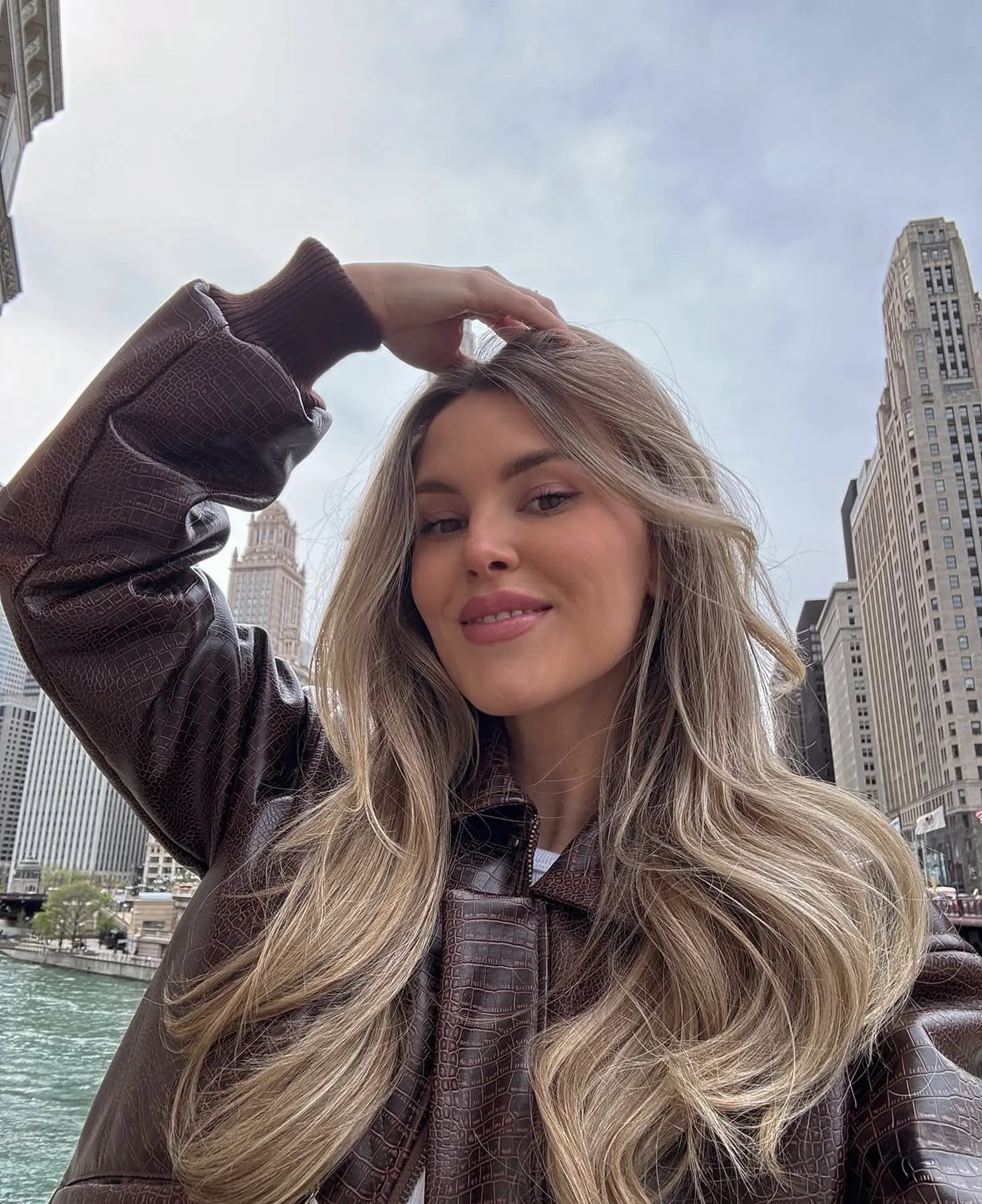 Medium-length beachy waves with a balayage of blonde and ash blonde tones. 2