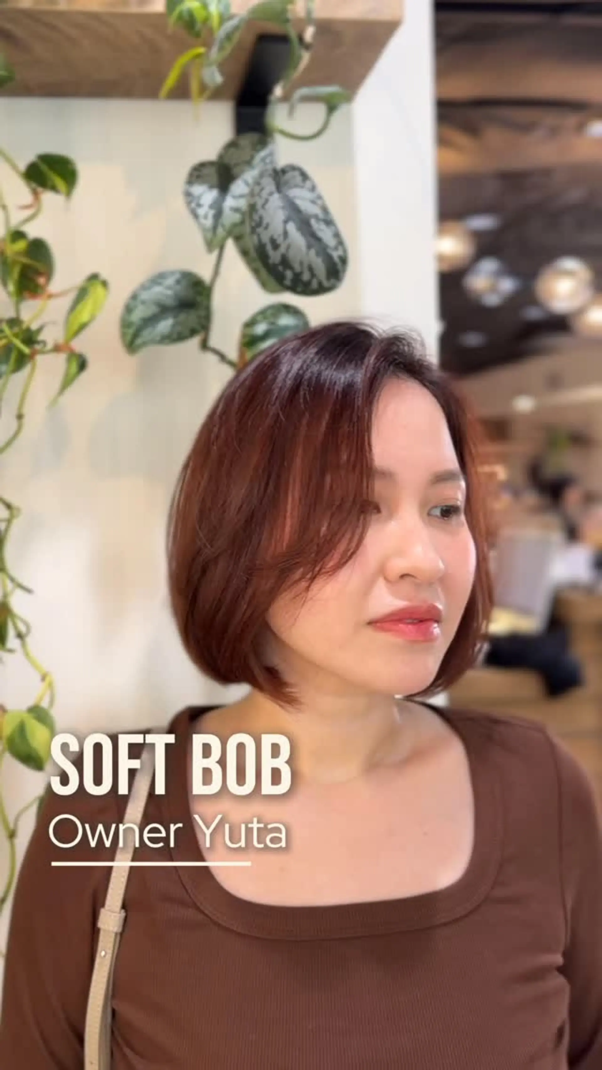 A chin-length soft bob haircut with subtle layers and effortless side-swept face-framing fringe. 1