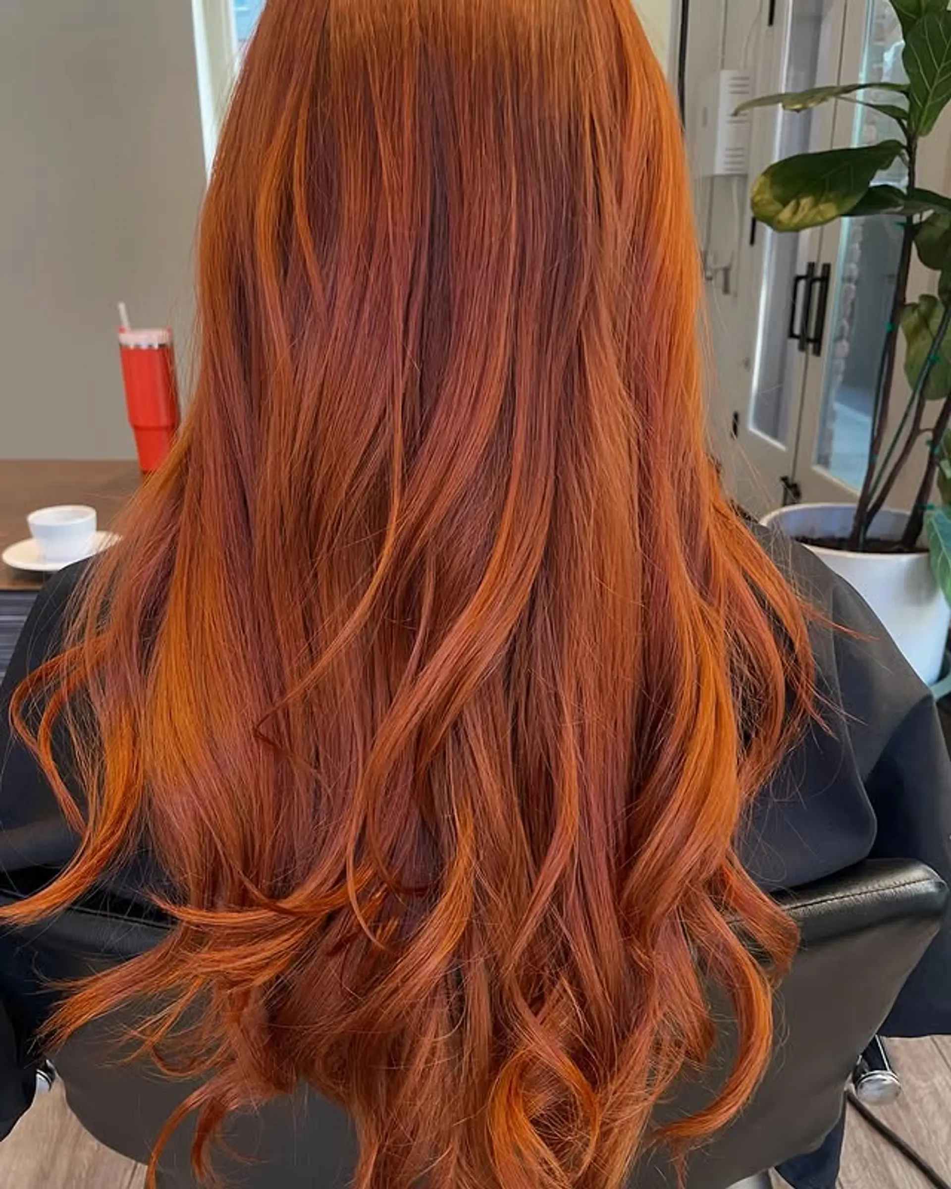 A long, wavy hairstyle with subtle layering to enhance movement and texture. 1