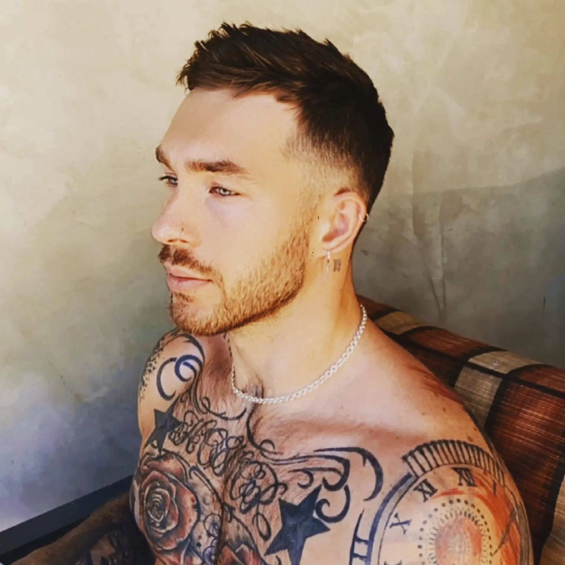 A men's short haircut featuring a textured, choppy top styled forward and a clean fade on the sides. 1
