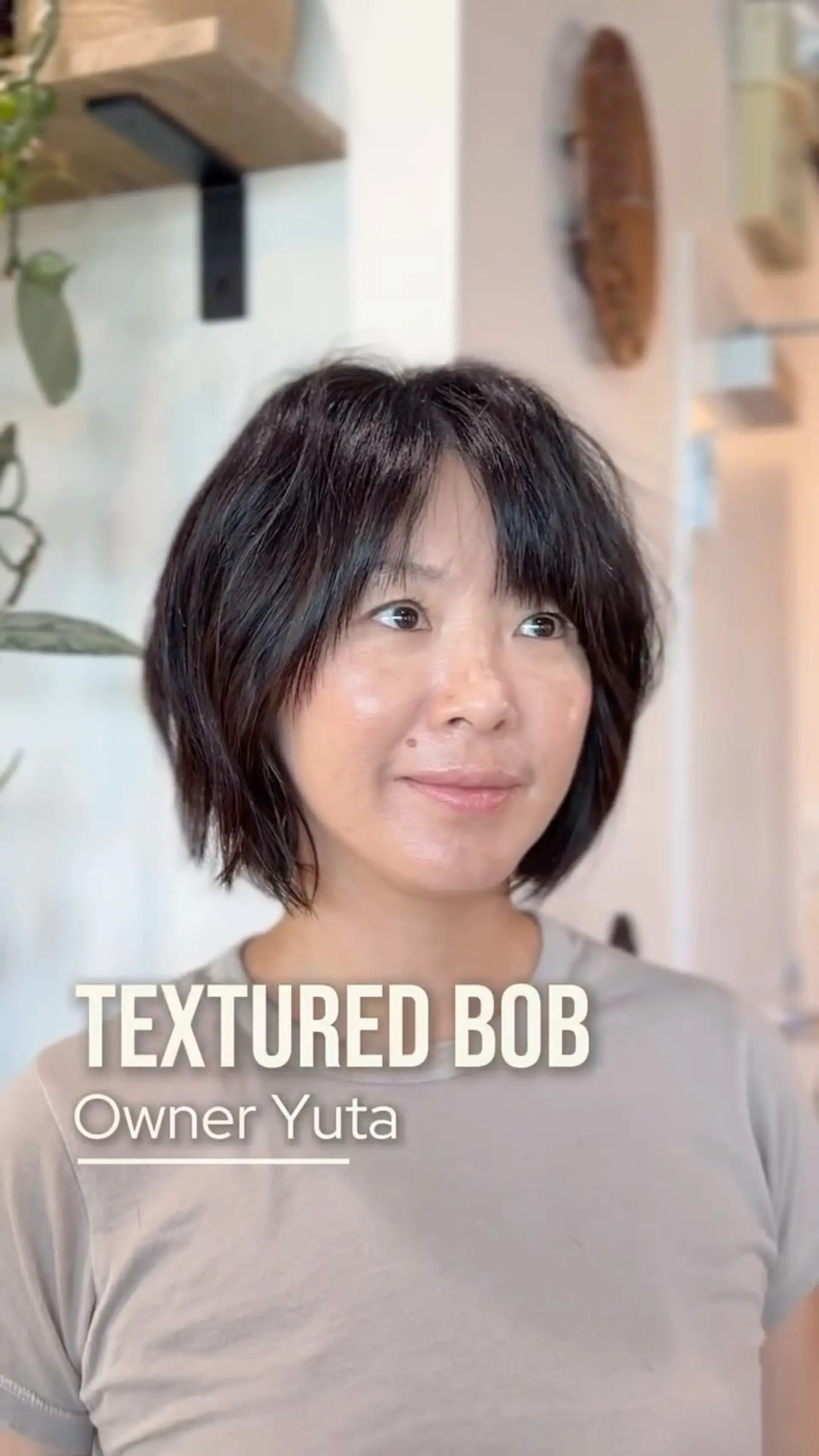 A textured chin-length bob with soft, wispy fringe bangs and piecey interior layering. 1