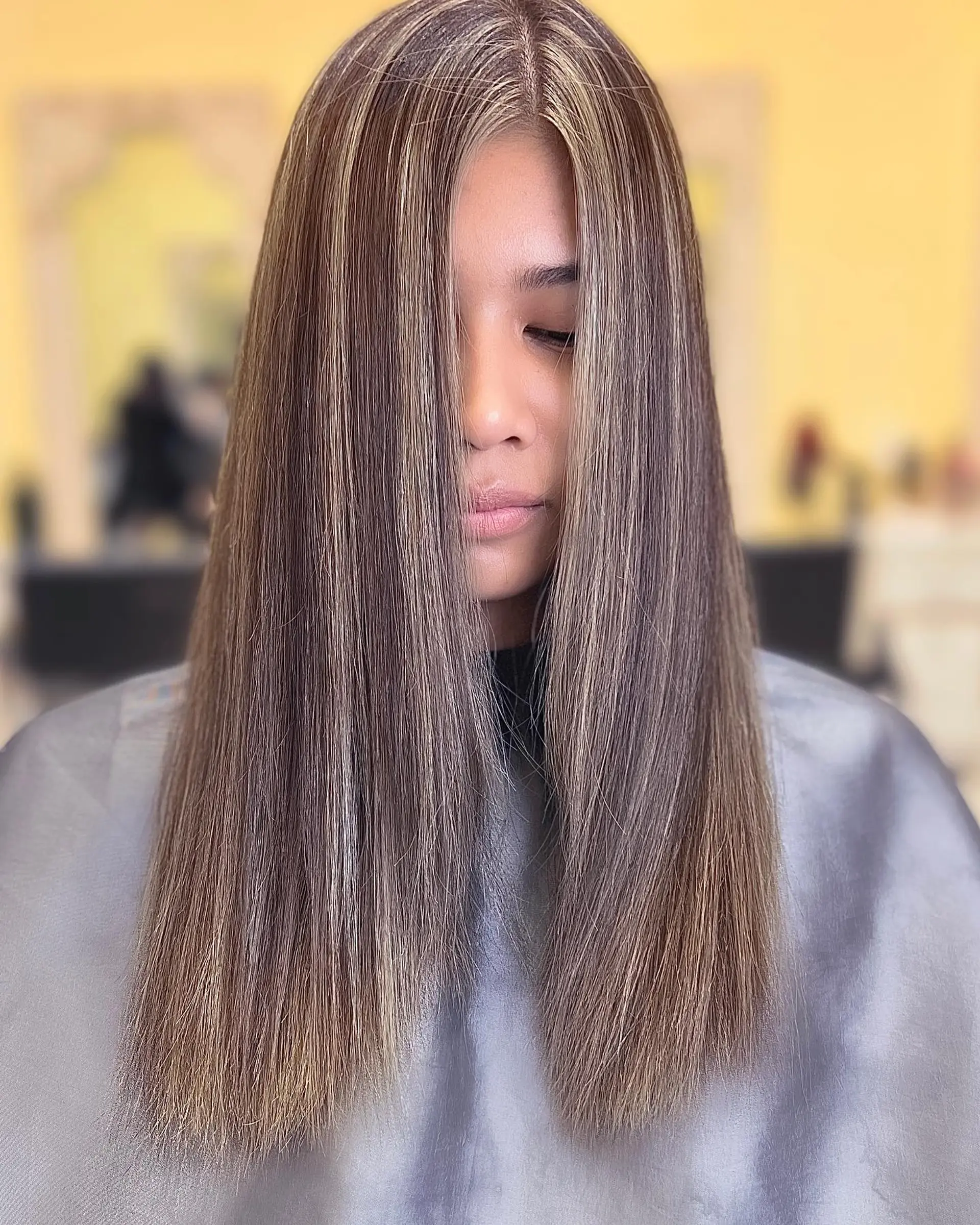 Long straight hair with subtle blonde highlights. 1