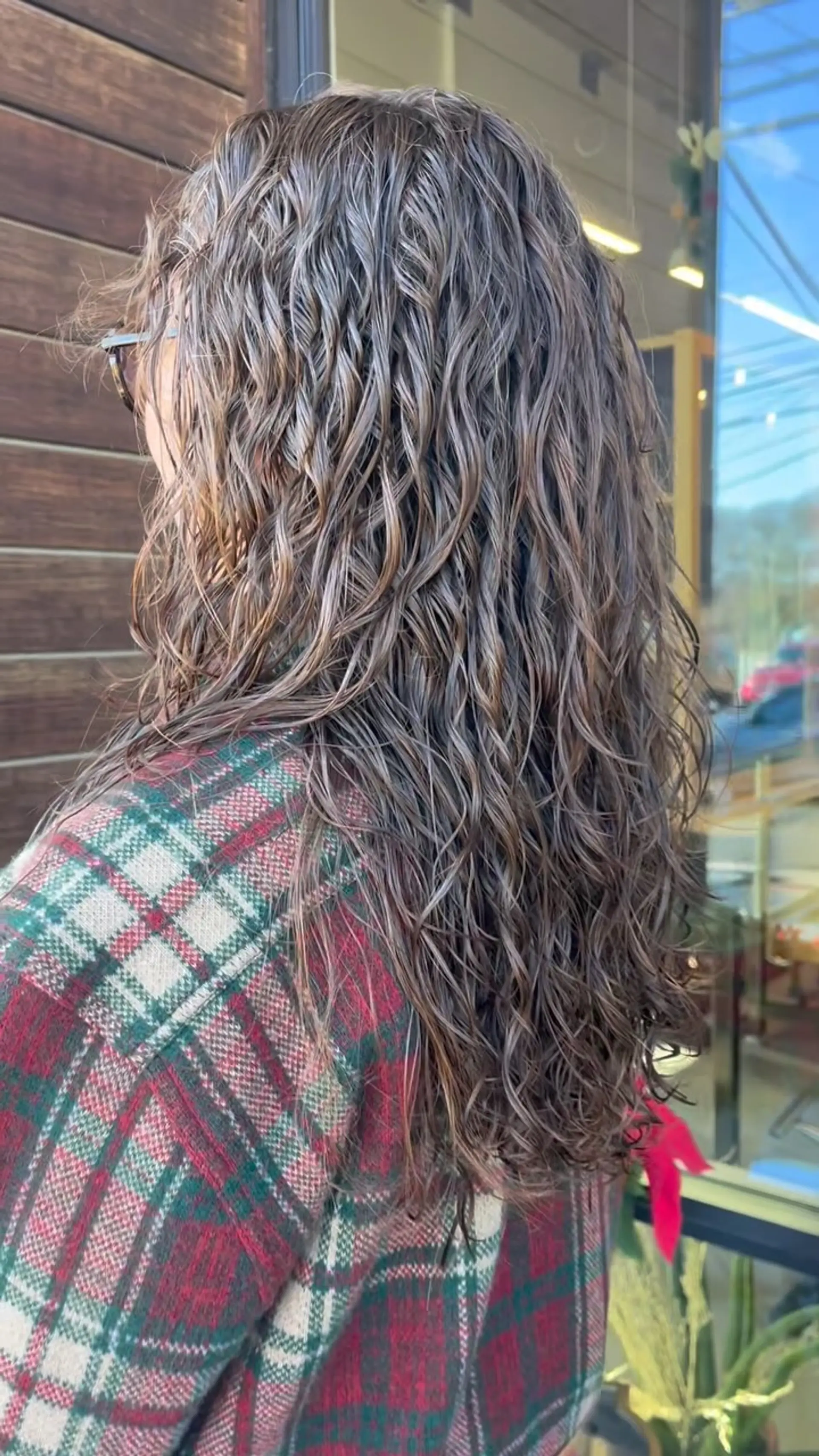 Long brunette hair styled with defined perm curls and waves. 1