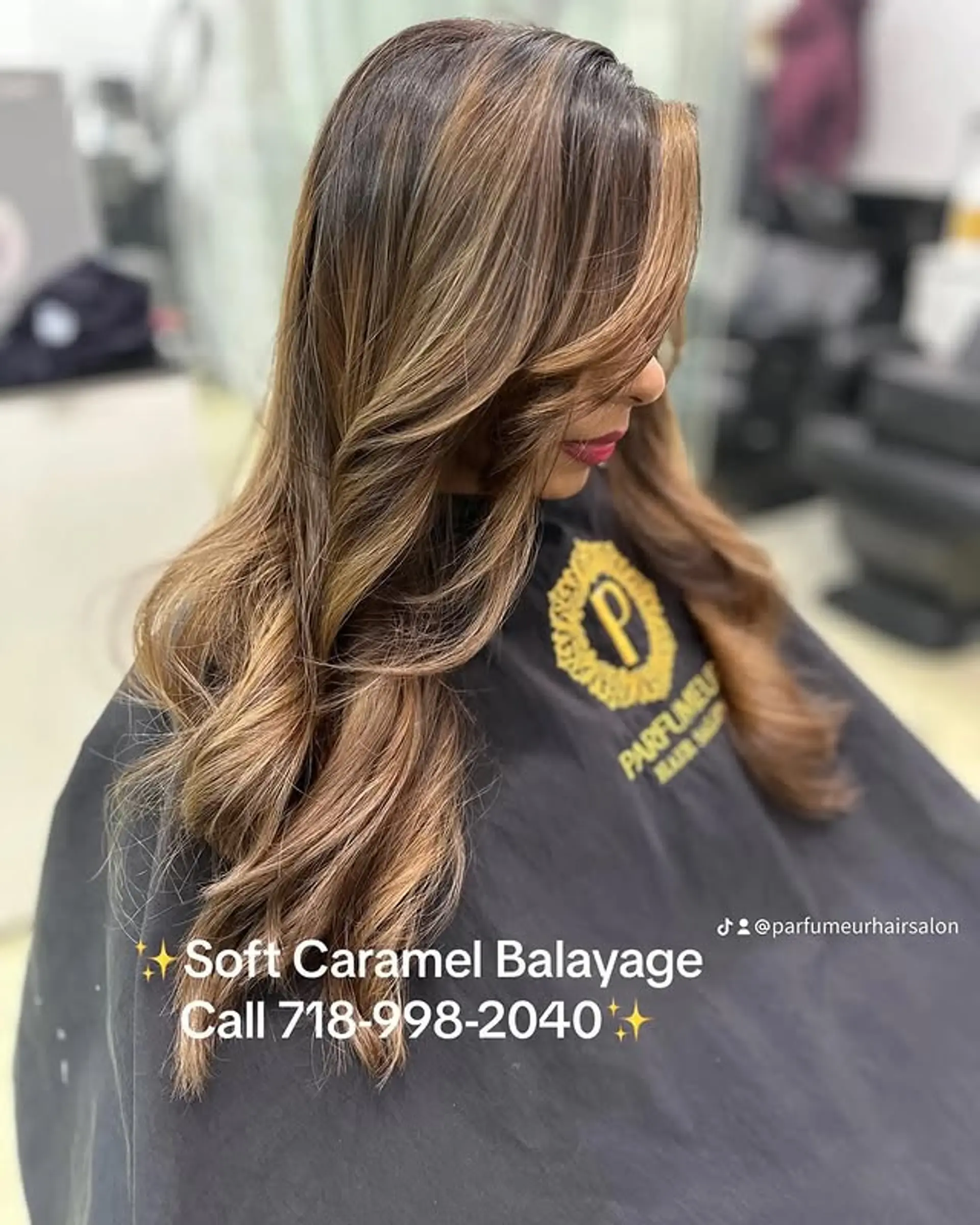 A long, wavy hairstyle with caramel balayage highlights. 1
