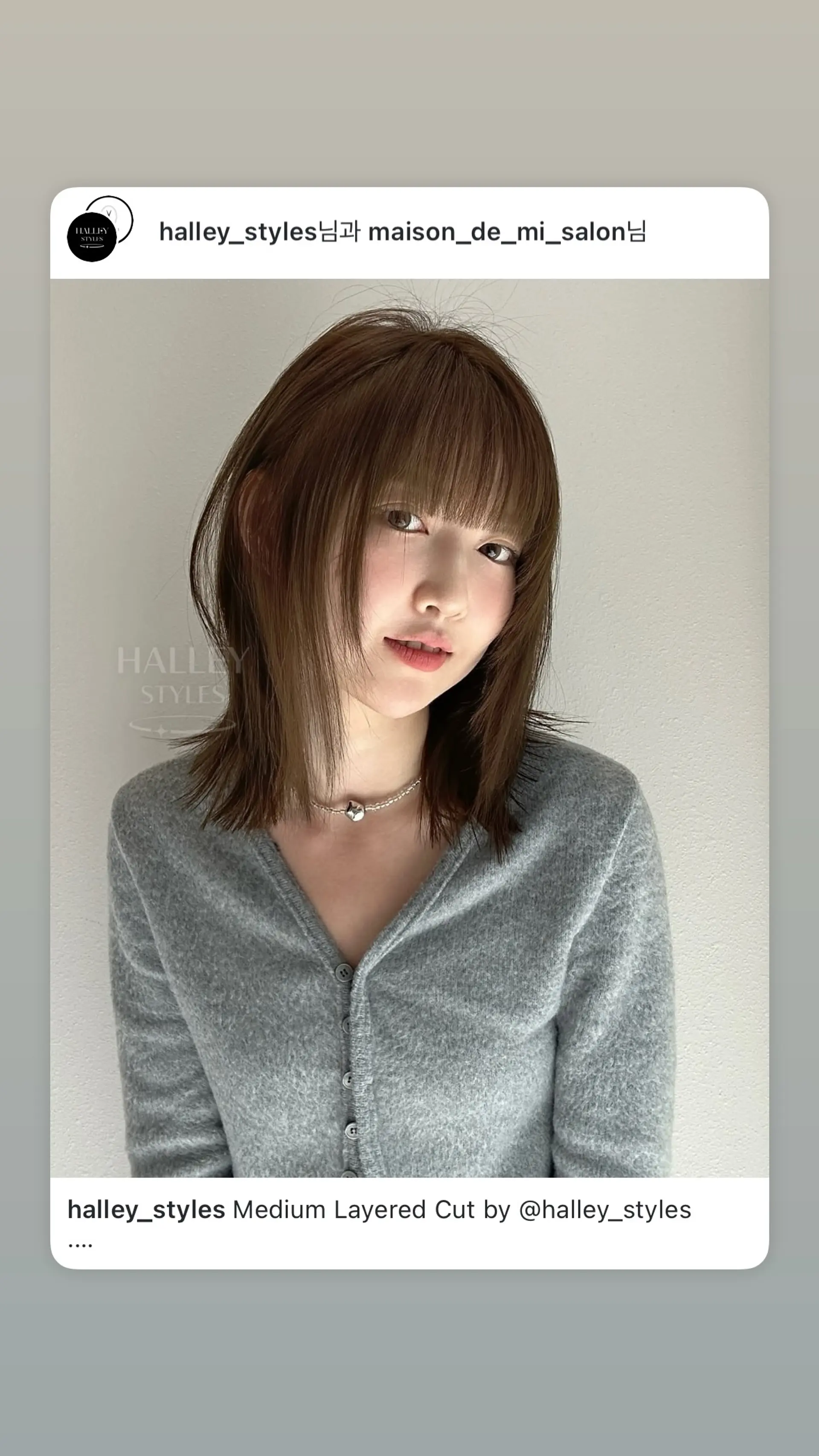 A trendy medium-length shag haircut with blunt bangs and lots of face-framing layers. 1