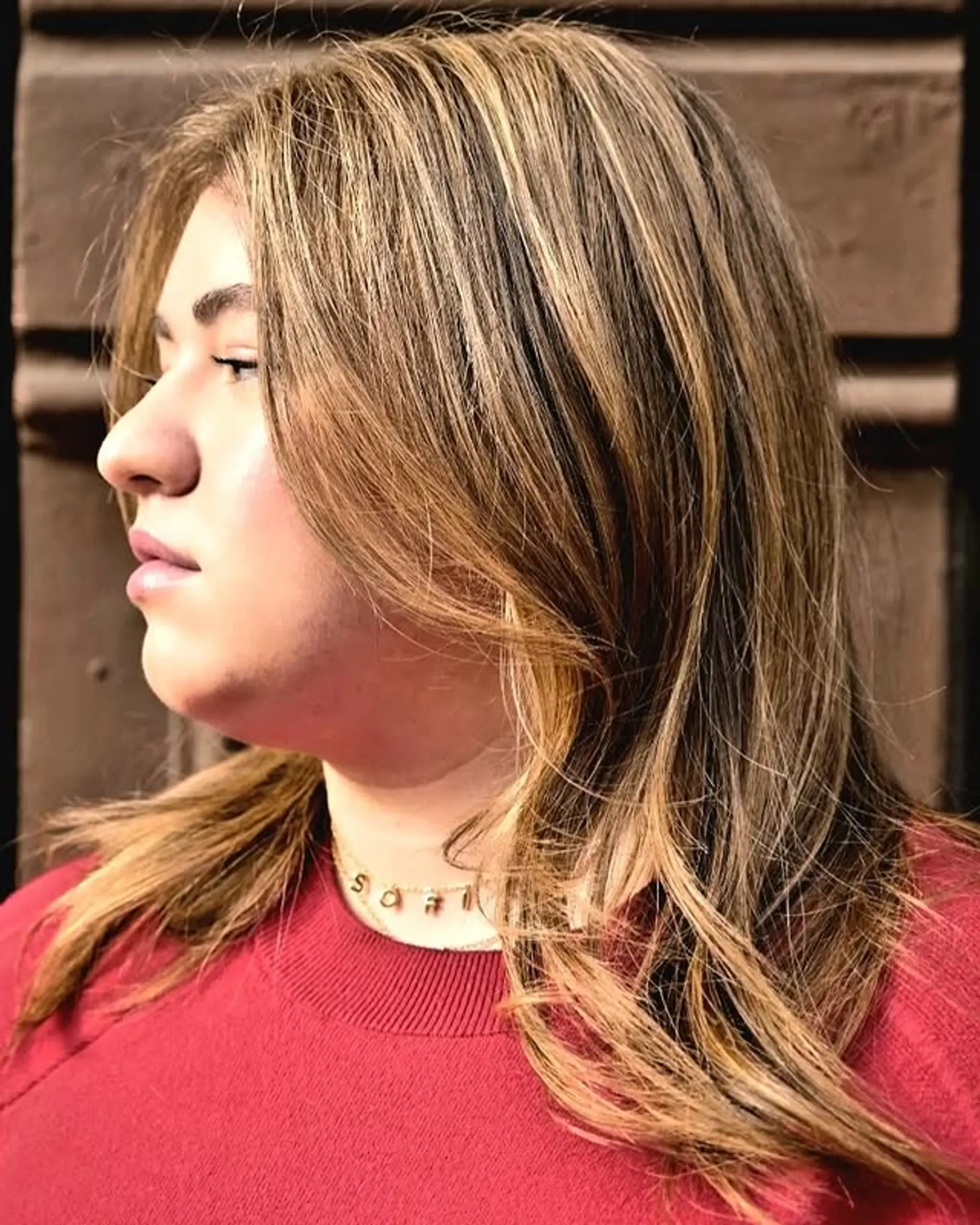 A layered medium length haircut with face-framing layers, creating a dimensional and low-maintenance style. 1