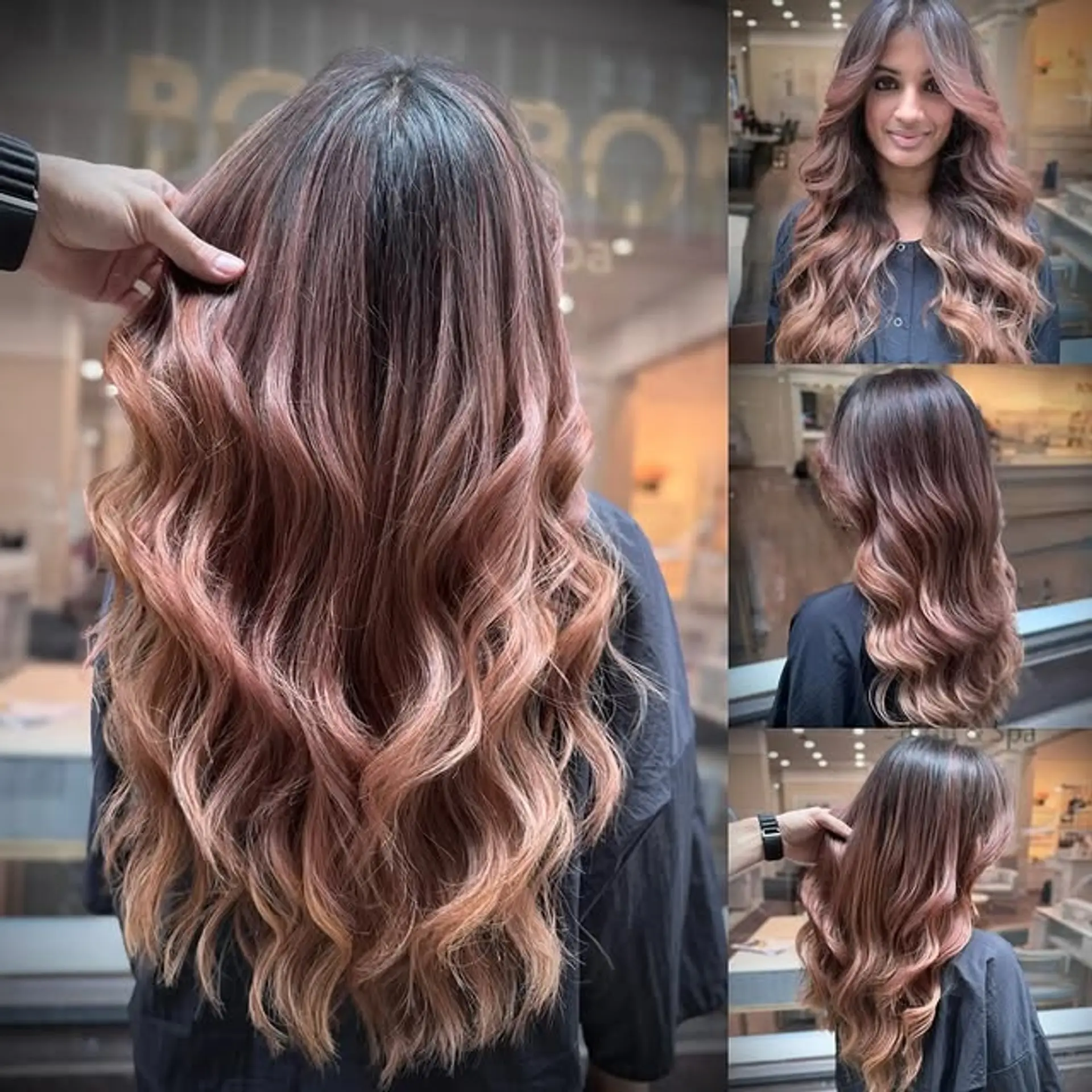 A long, wavy hairstyle with a dark root transitioning into a rose gold ombre, styled with large waves and face-framing layers. 1