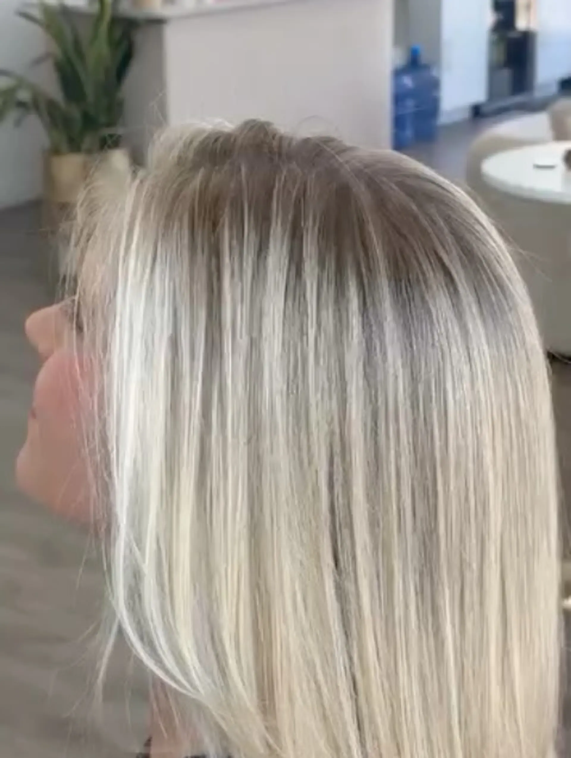 Straight medium-length hair featuring bright blonde tones with a soft, blended shadow root for seamless dimension. 1