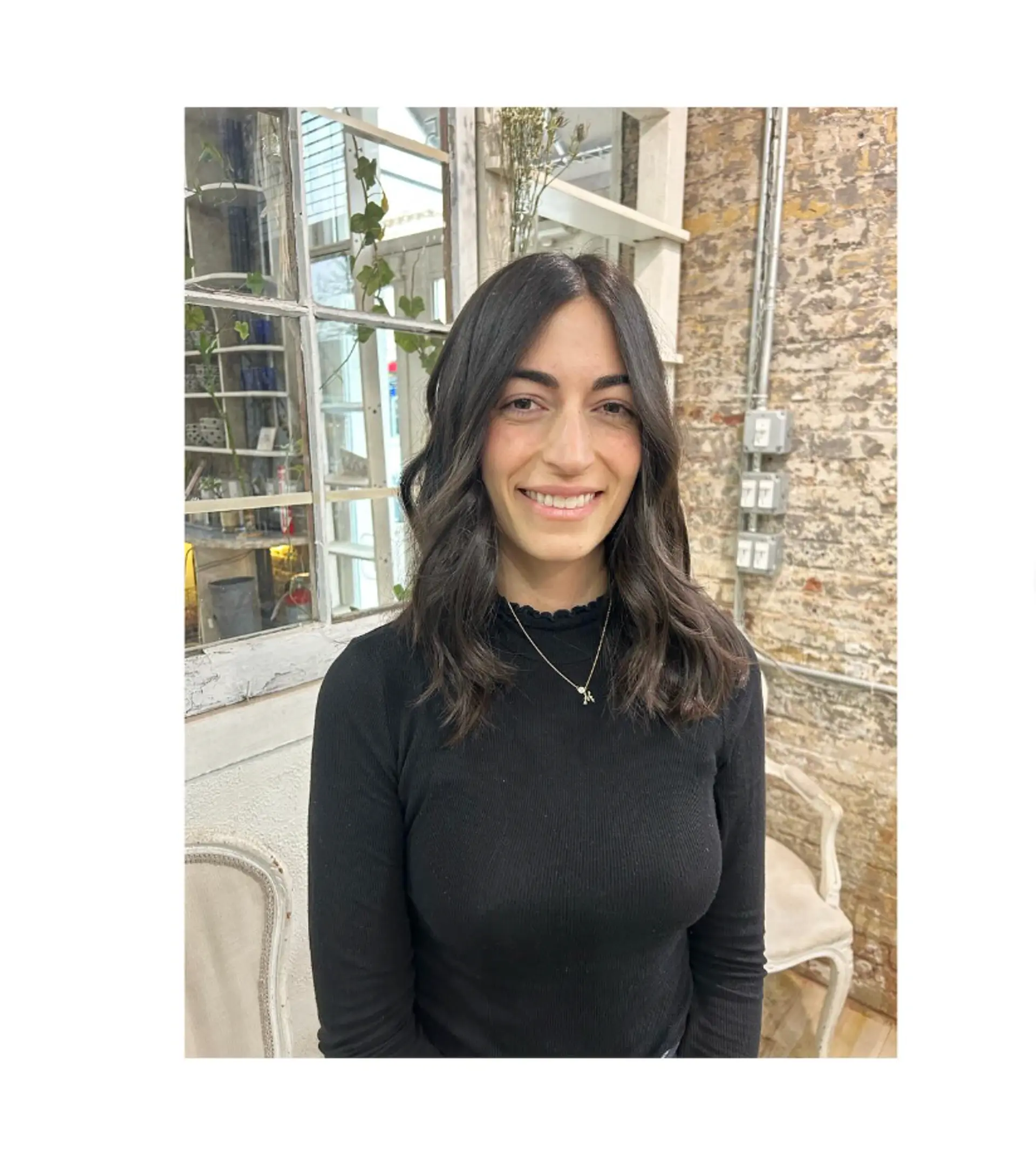 A wavy, medium-length hairstyle with soft waves and face-framing layers. 1