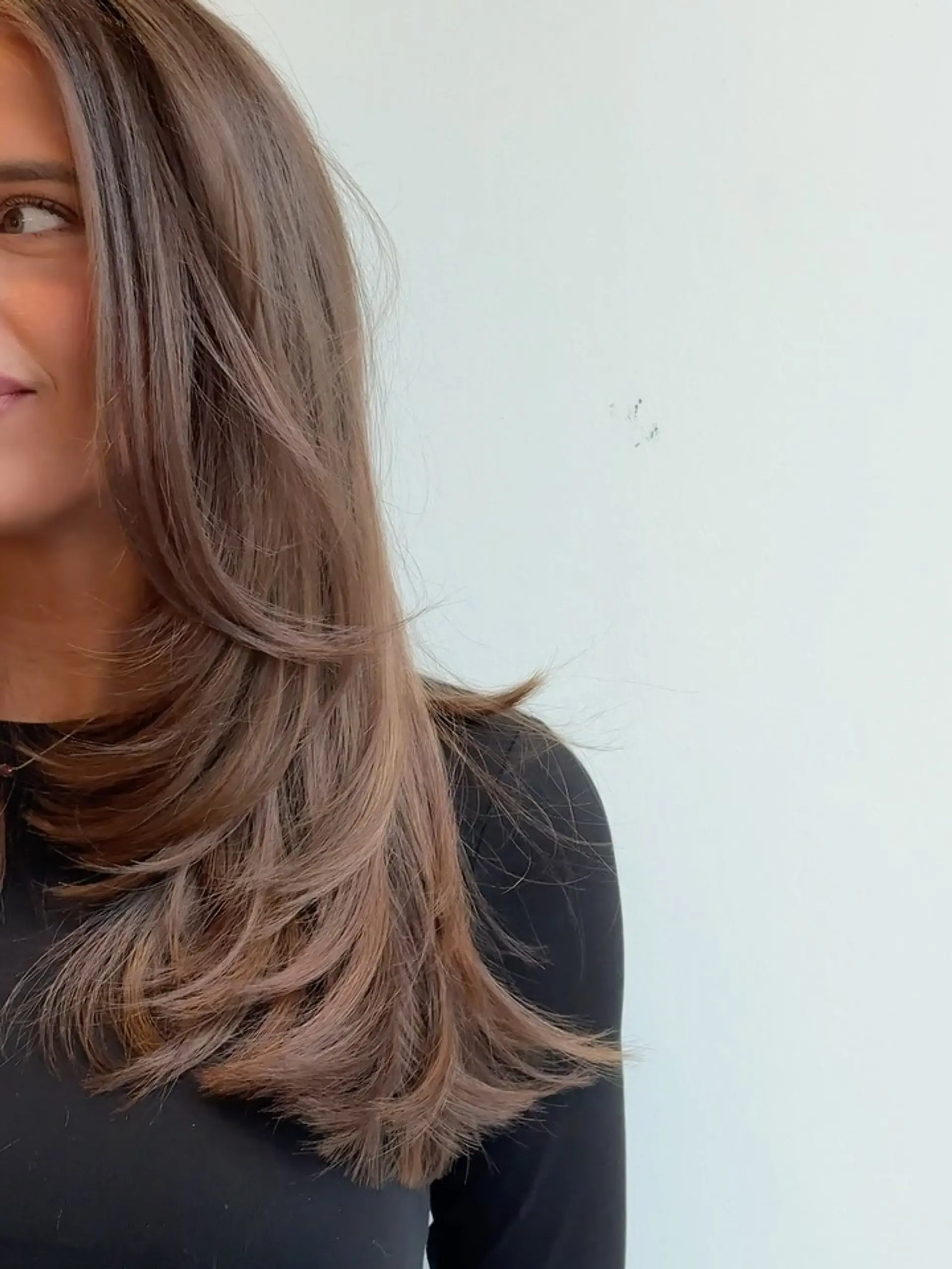 Long chocolate brown hair featuring soft, cascading face-framing layers styled in a voluminous blowout. 1