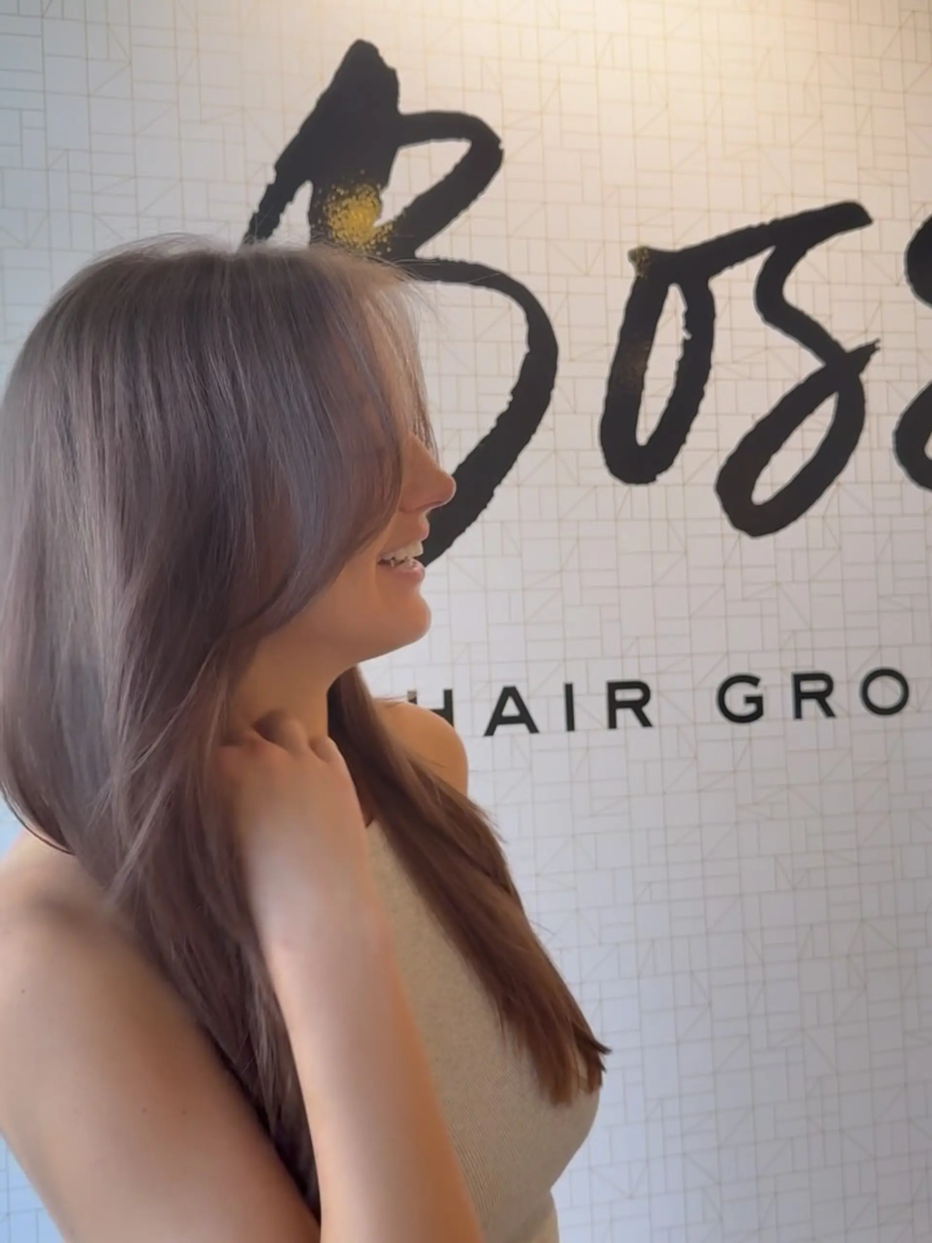 Long, cool-toned brunette hair styled with soft face-framing layers and a sleek, shiny blowout. 1