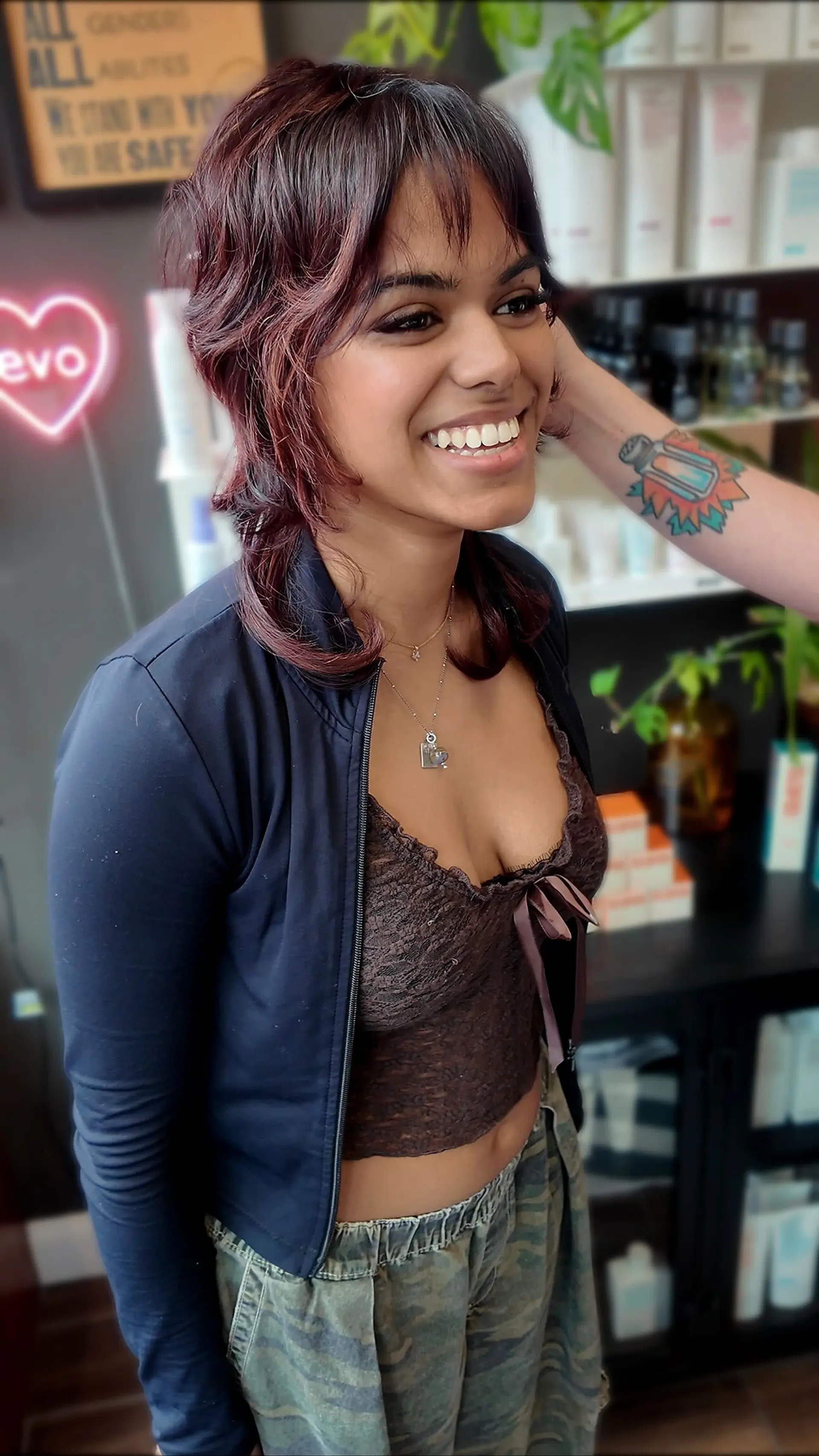 A textured jellyfish shag cut featuring voluminous top layers, wispy bangs, and disconnected mid-length ends with a subtle flip. 1
