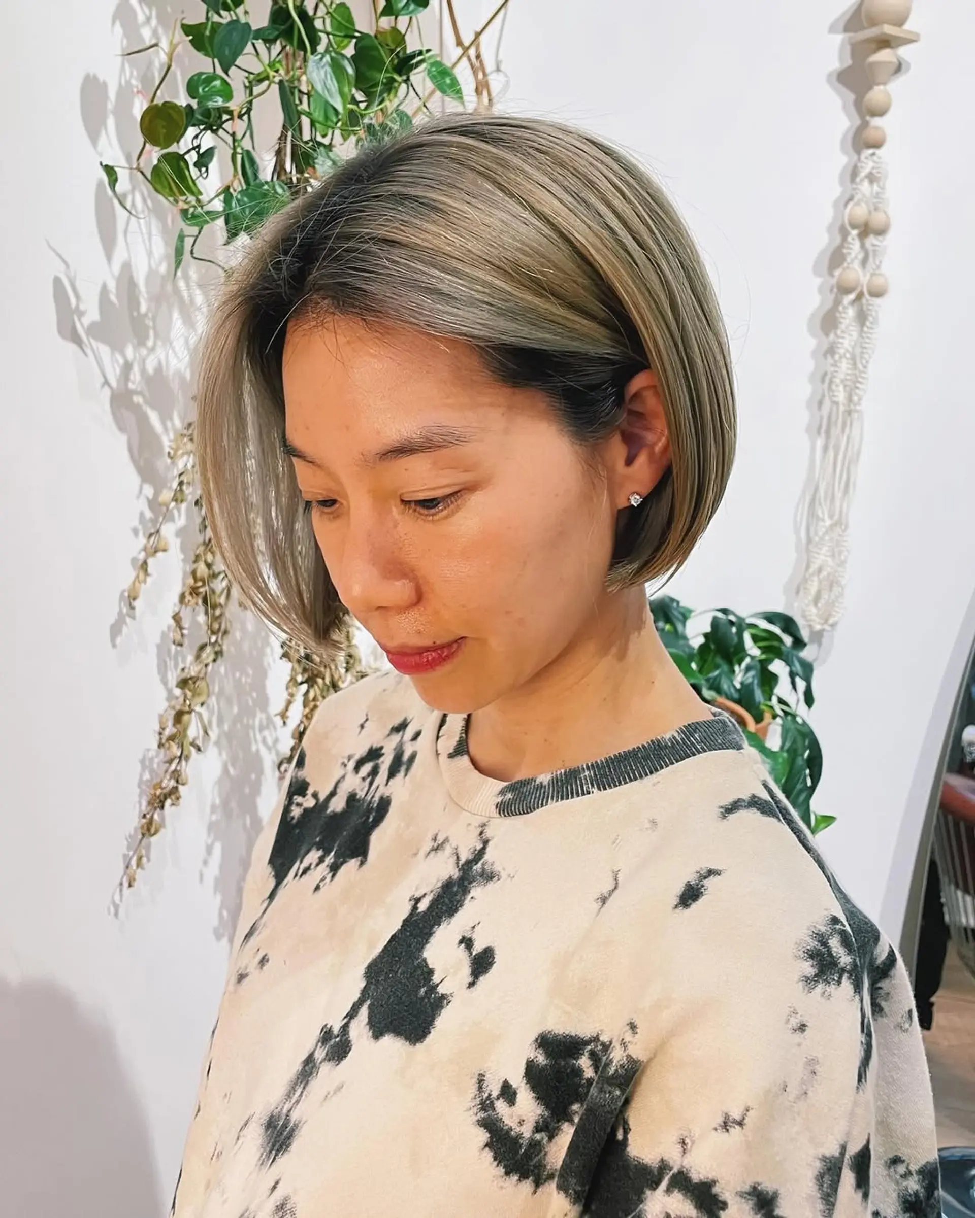 A chin-length blunt bob with subtle face-framing layers. 2
