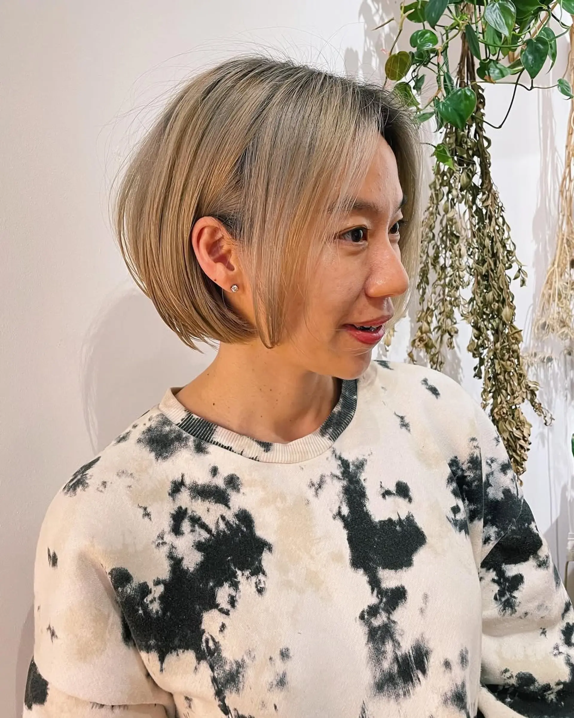 A chin-length blunt bob with subtle face-framing layers. 3