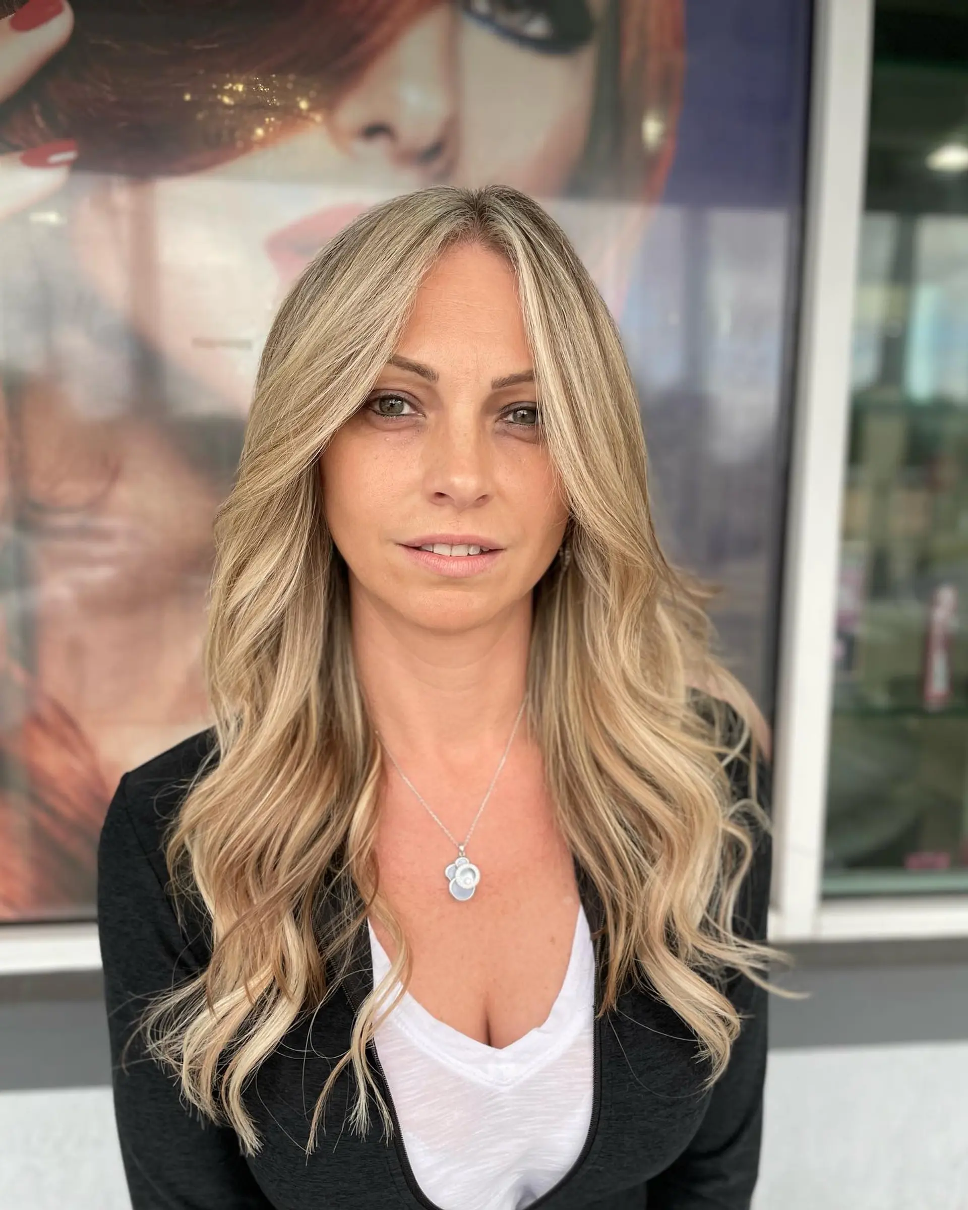 Long, golden blonde wavy hair with face-framing layers and subtle highlights. 1