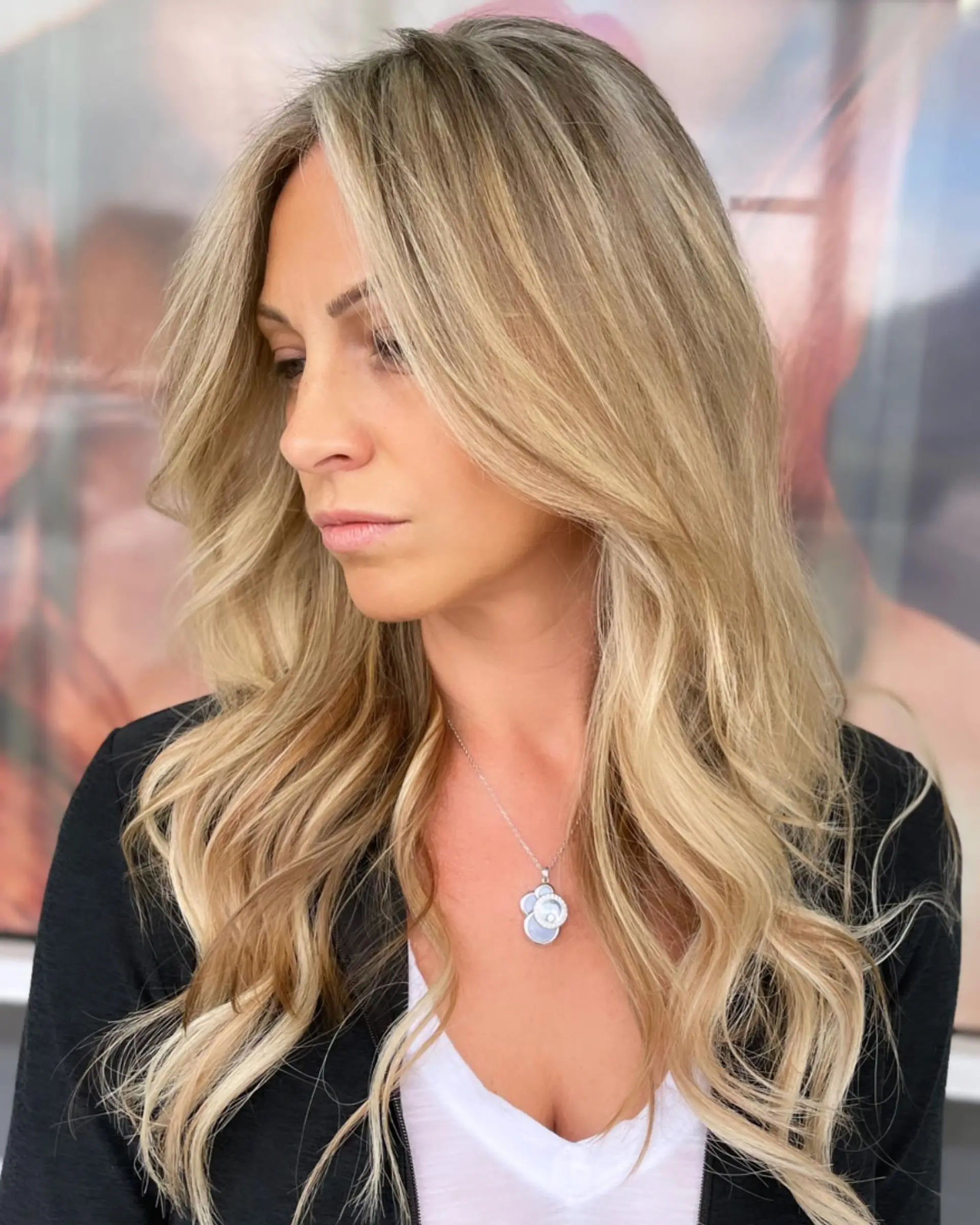 Long, golden blonde wavy hair with face-framing layers and subtle highlights. 2