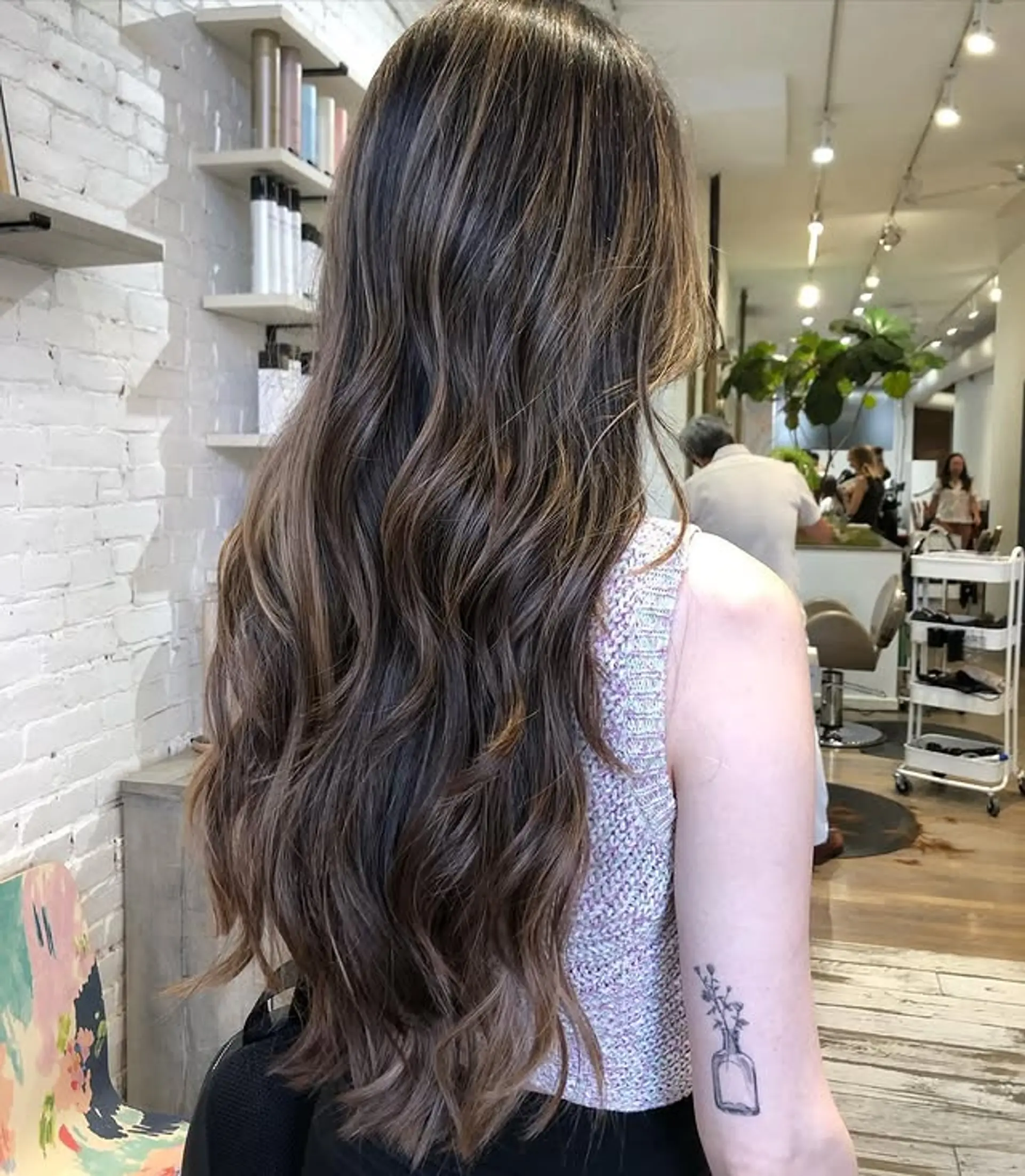 Long, layered wavy hair with a Bronde Balayage effect. 1