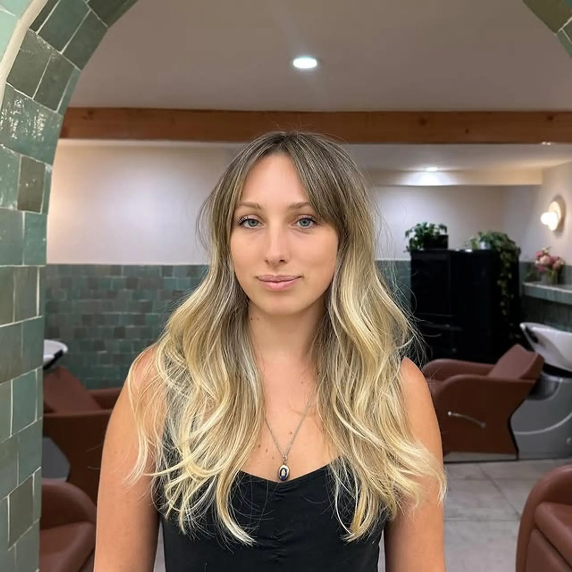 A beautiful, long, wavy bronde hairstyle with textured bangs. 1