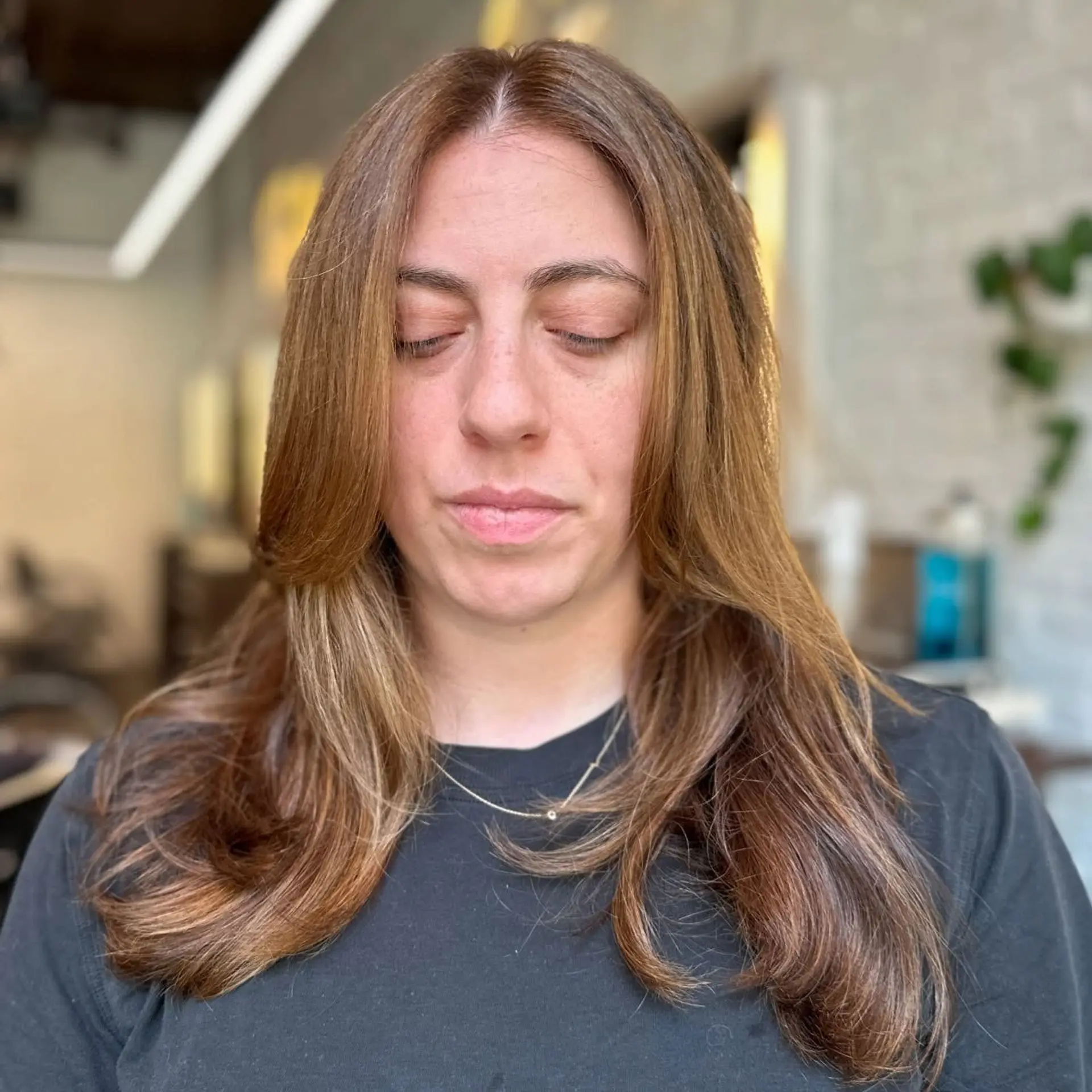 Long, layered hairstyle with a bronde balayage and face-framing layers. 1