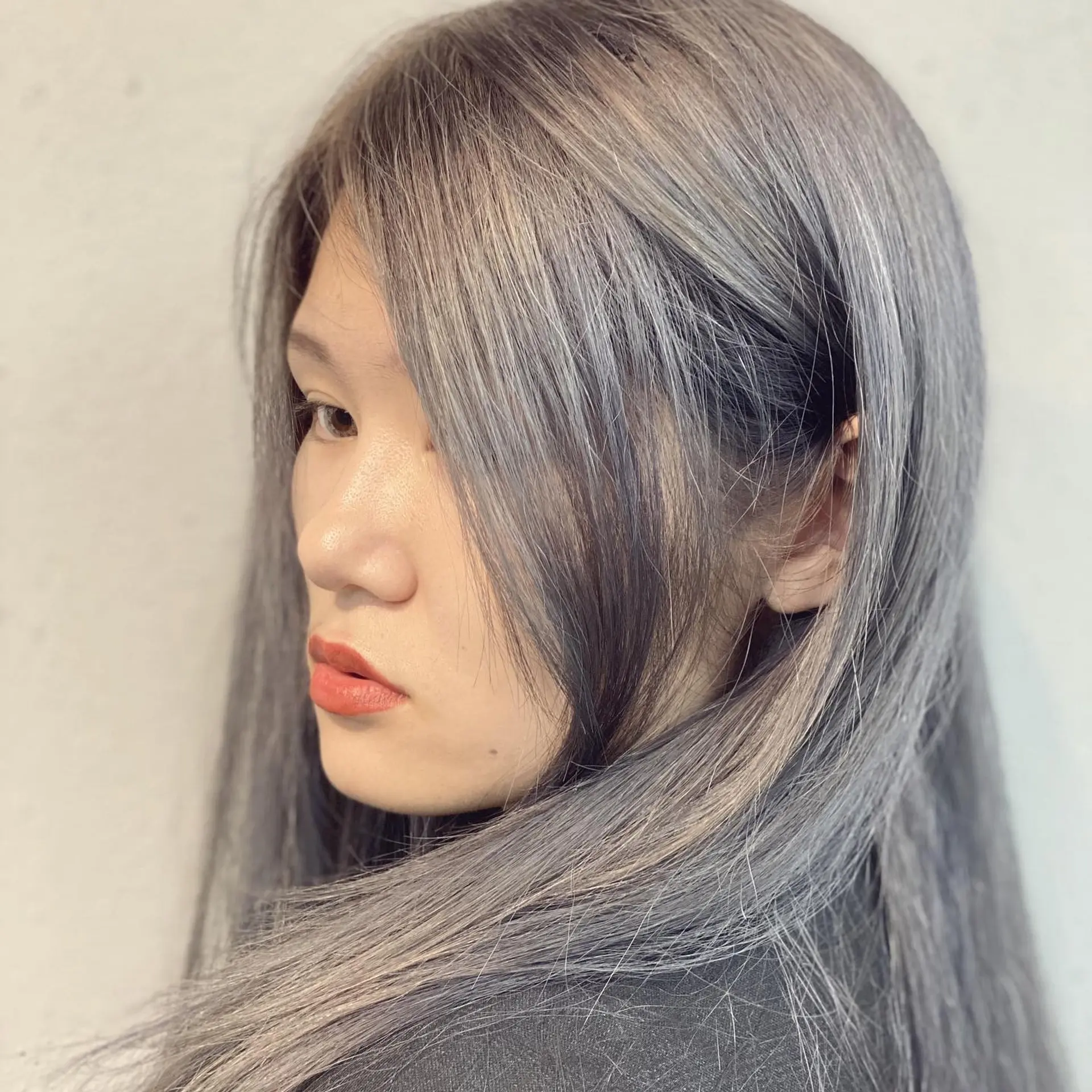 Long straight hair with a striking steel blue ombre color. 2