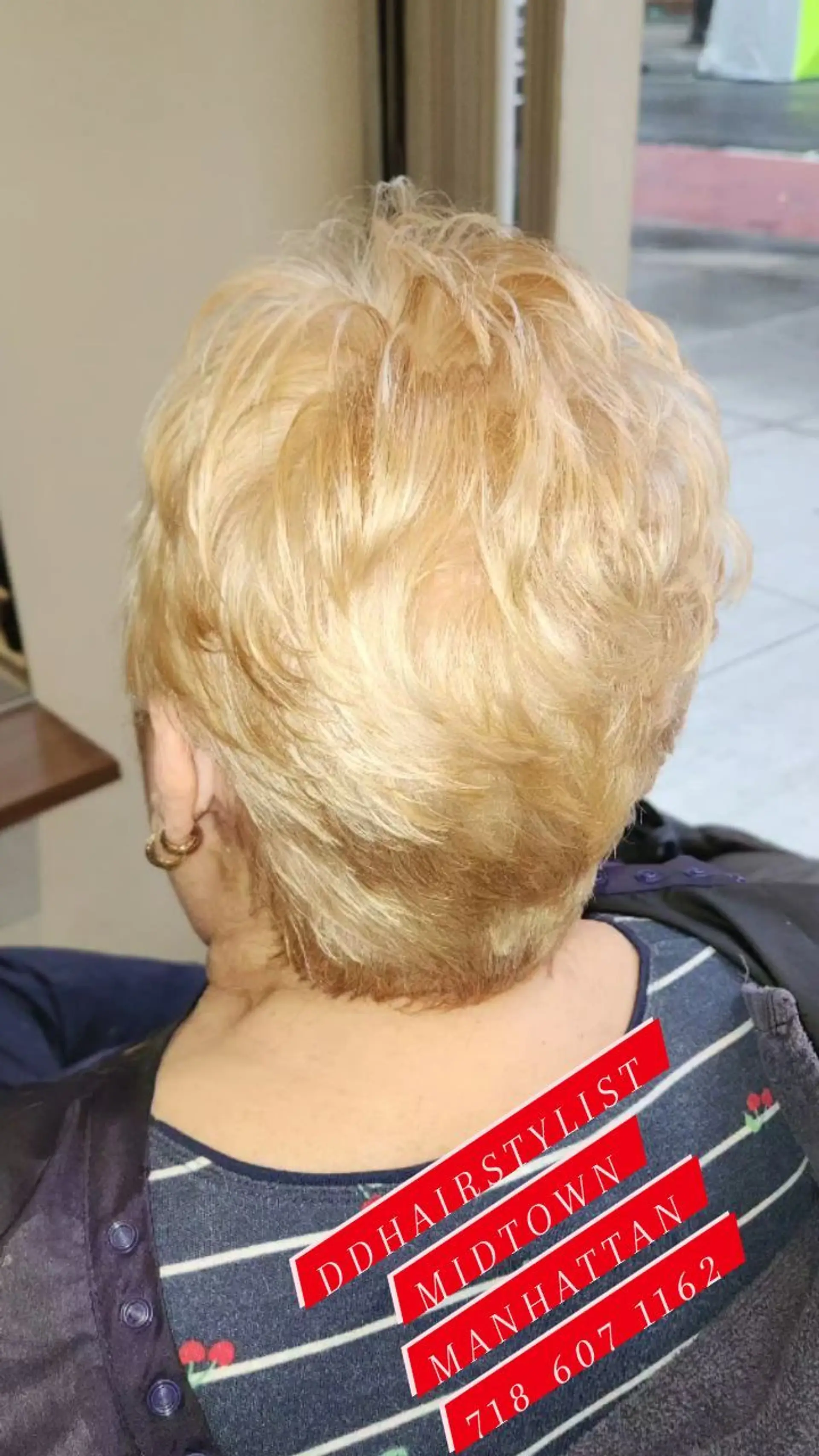 A textured short layered pixie cut with feathered crown layers and a tapered nape in a warm blonde tone. 1