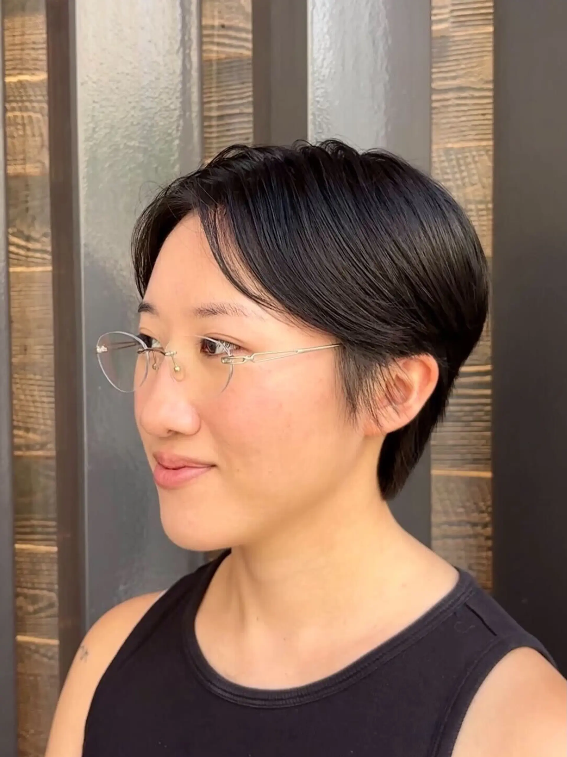 A refined short pixie cut with soft curtain fringe and lightly textured sides. 1