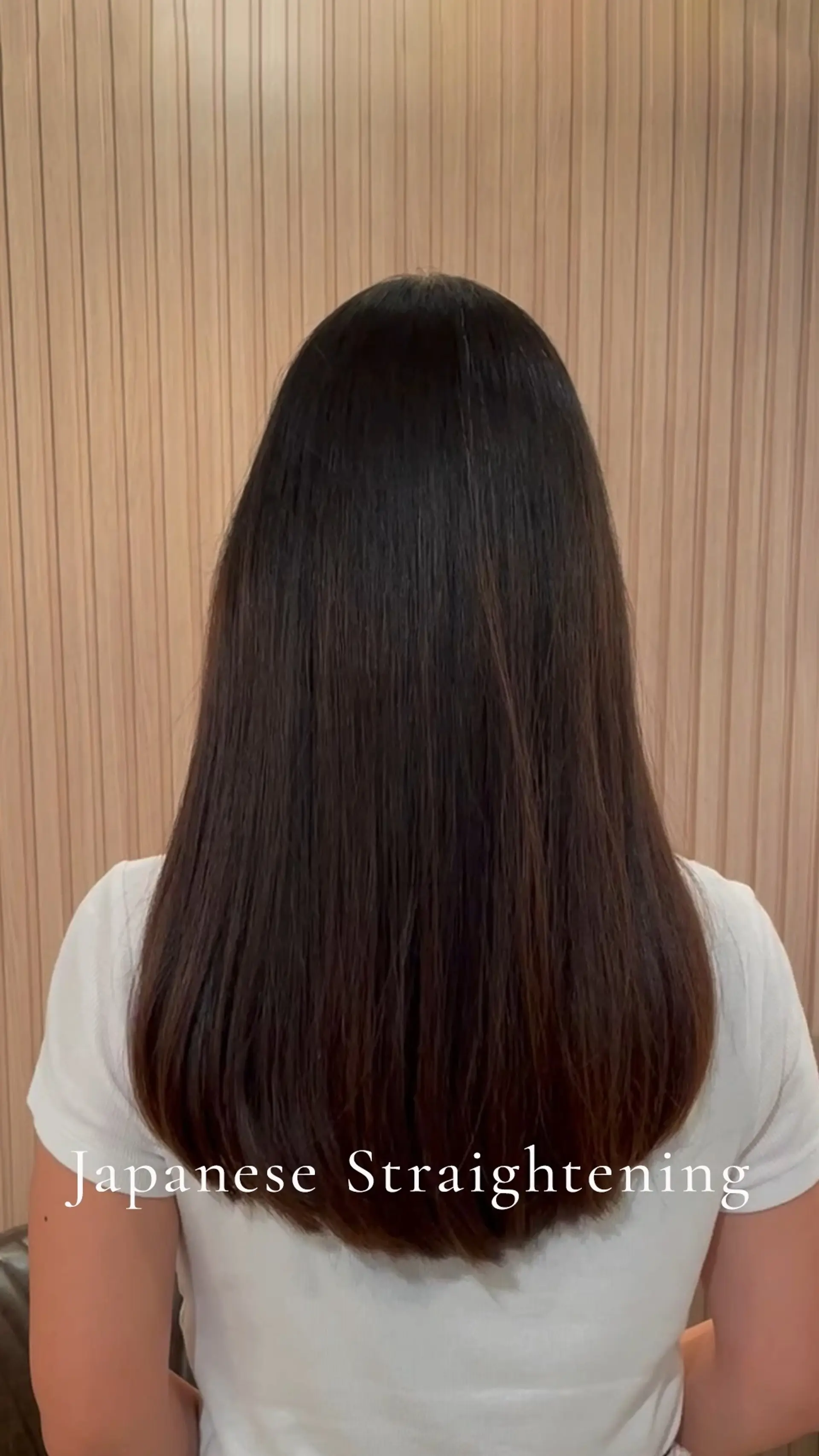 Long, dark brown hair straightened with a smooth, sleek finish and softly curved ends. 1