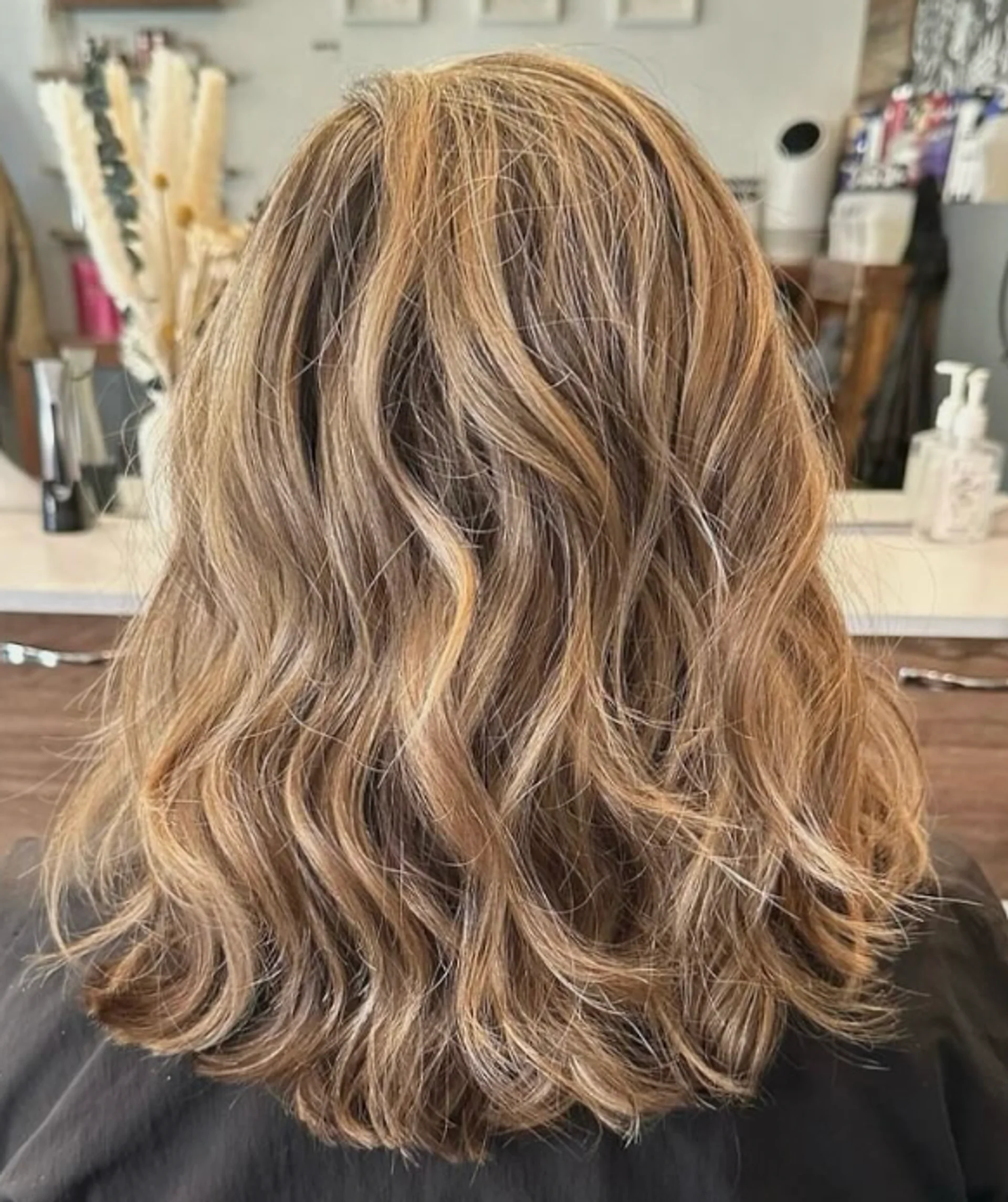 A very long, wavy blonde hairstyle with face-framing layers and sun-kissed highlights, featuring a natural, soft flow and subtle waves. by Coz Salon - Preview 2
