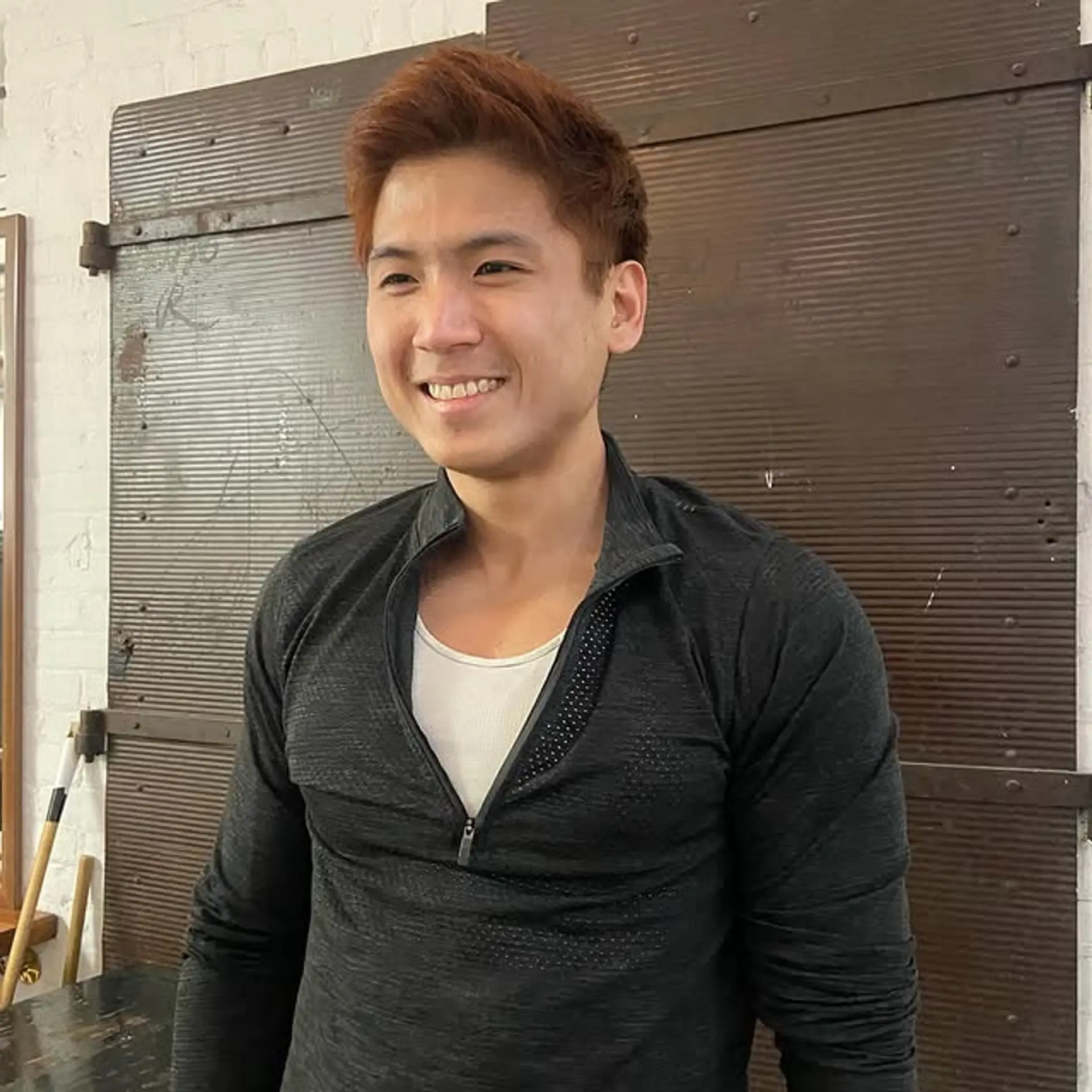 A short, textured haircut with copper highlights. 1