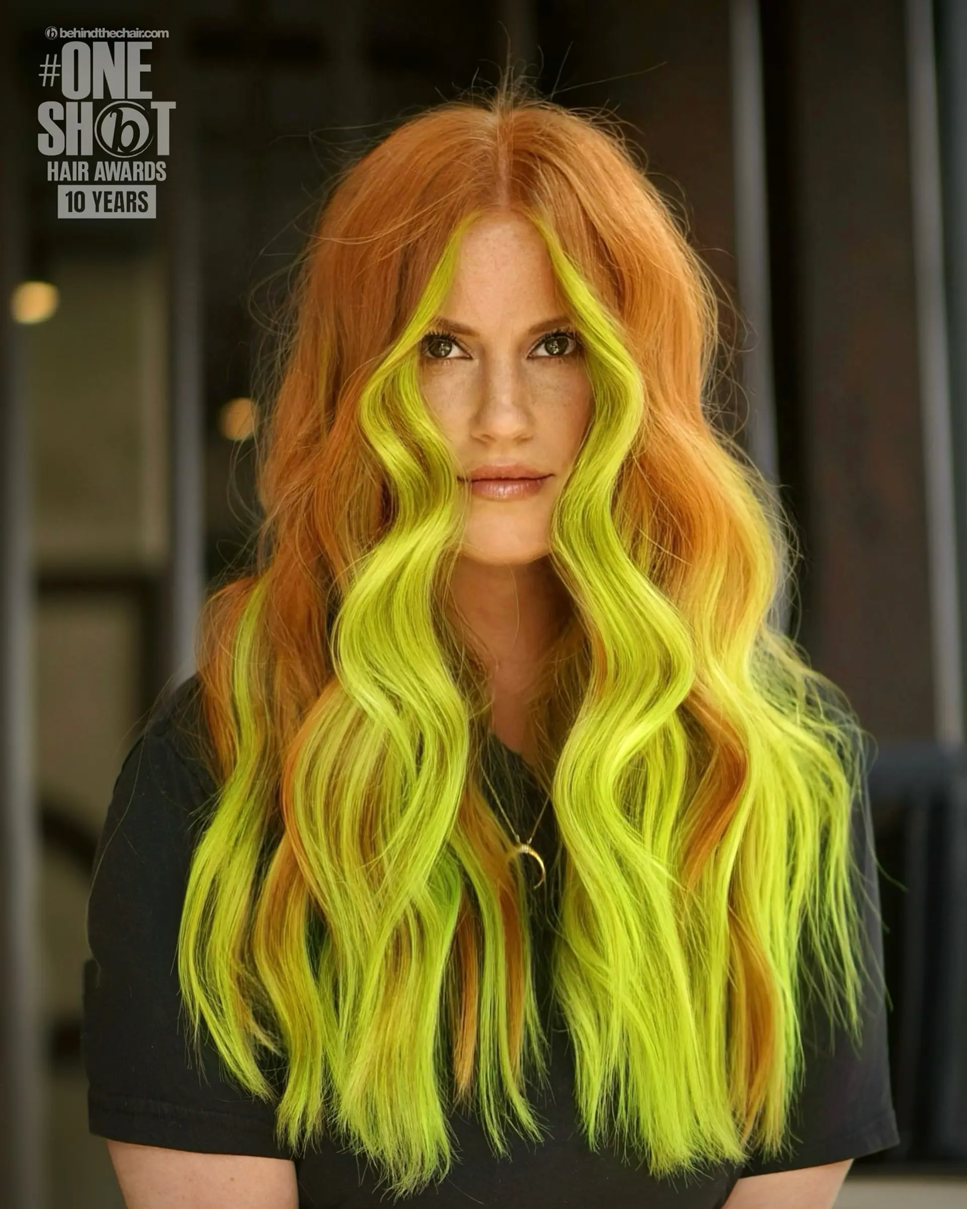 Long copper hair styled in soft waves featuring a bold neon green face-framing money piece. 1