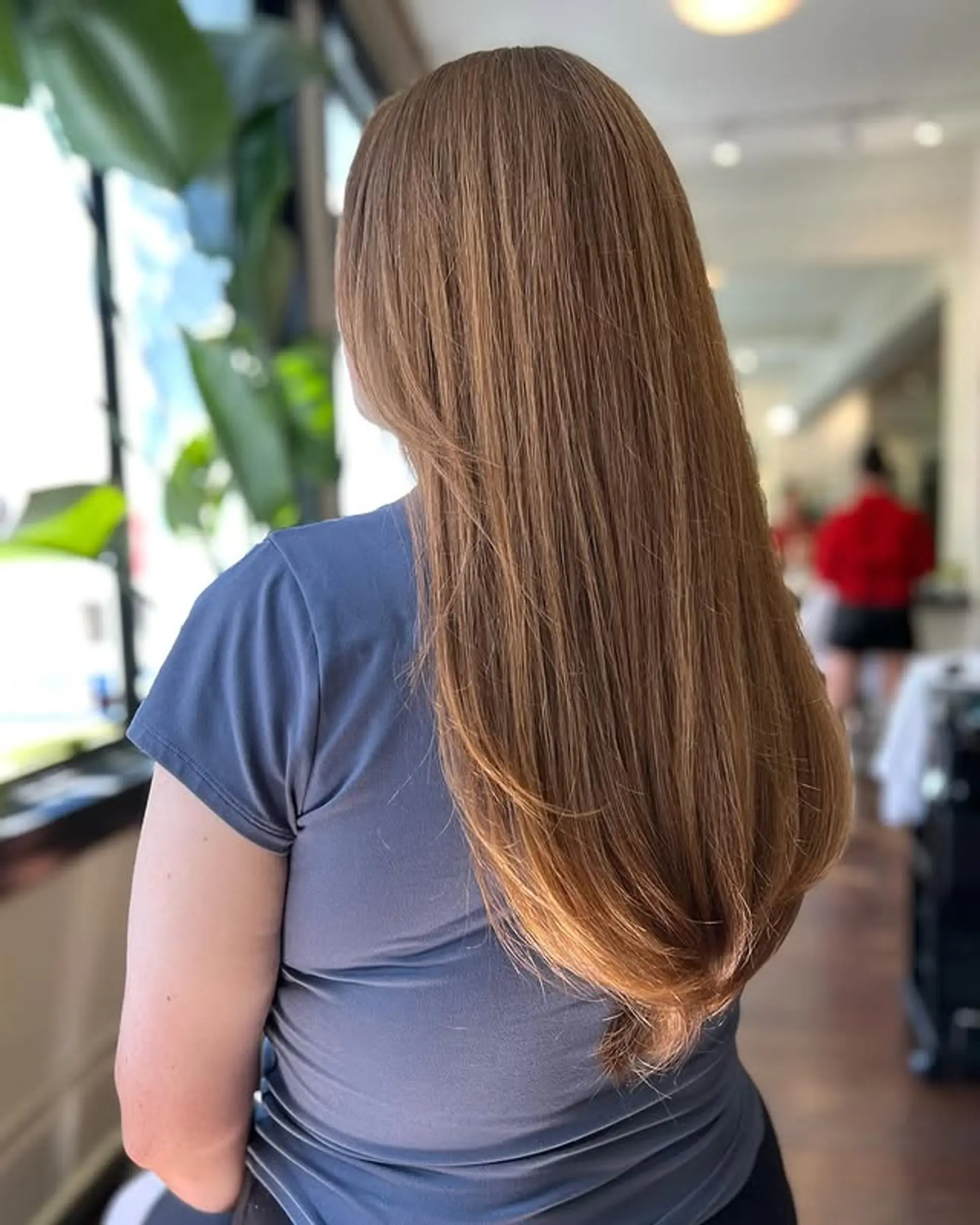 Long, straight hair with layered haircut and face-framing layers. 1