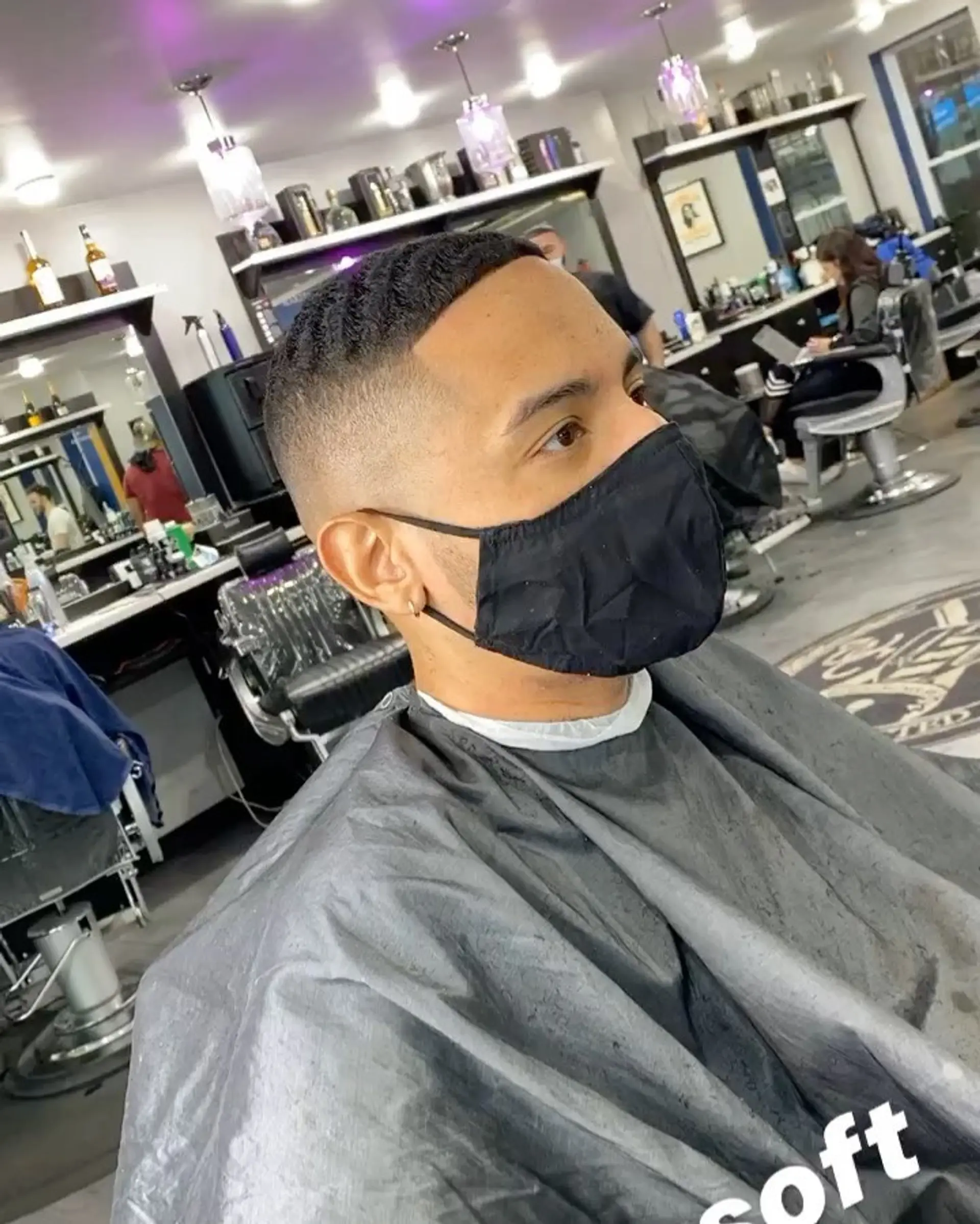 A clean short cut featuring structured waves on top paired with a precise skin fade and defined hairline. 1