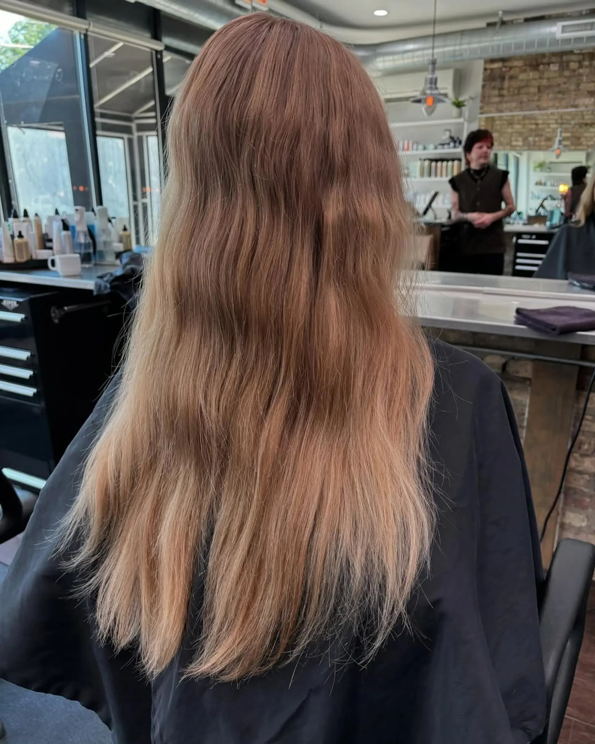 A chic, short, layered bob haircut featuring soft curtain bangs and face-framing layers for a modern and bouncy look. The length sits just above the shoulders, creating a fresh and youthful silhouette. 2