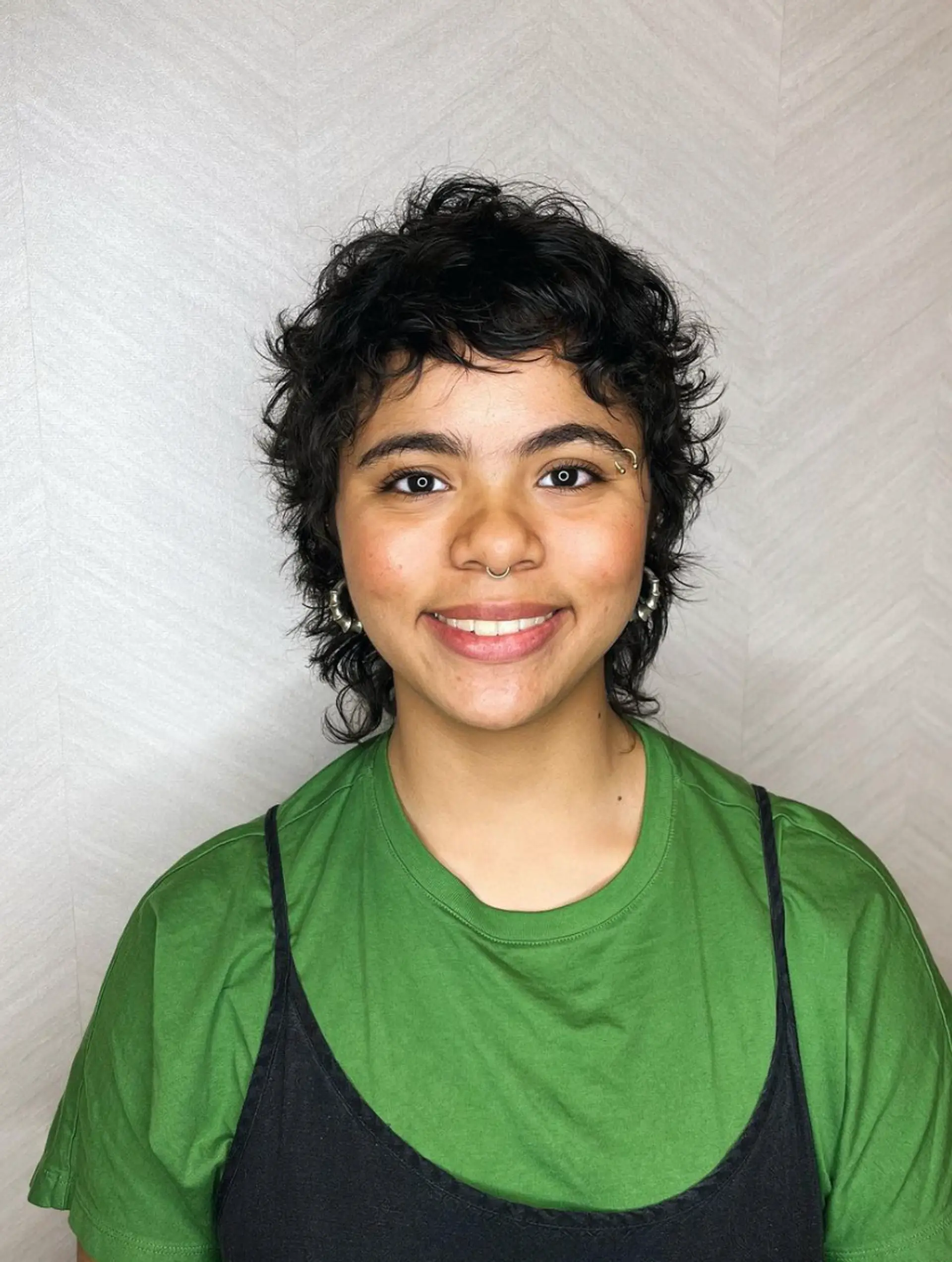 Shaggy, wavy pixie mullet with short, textured layers and a tapered back, featuring a messy, layered fringe.

Cut and style by @juliamannino_hair 2