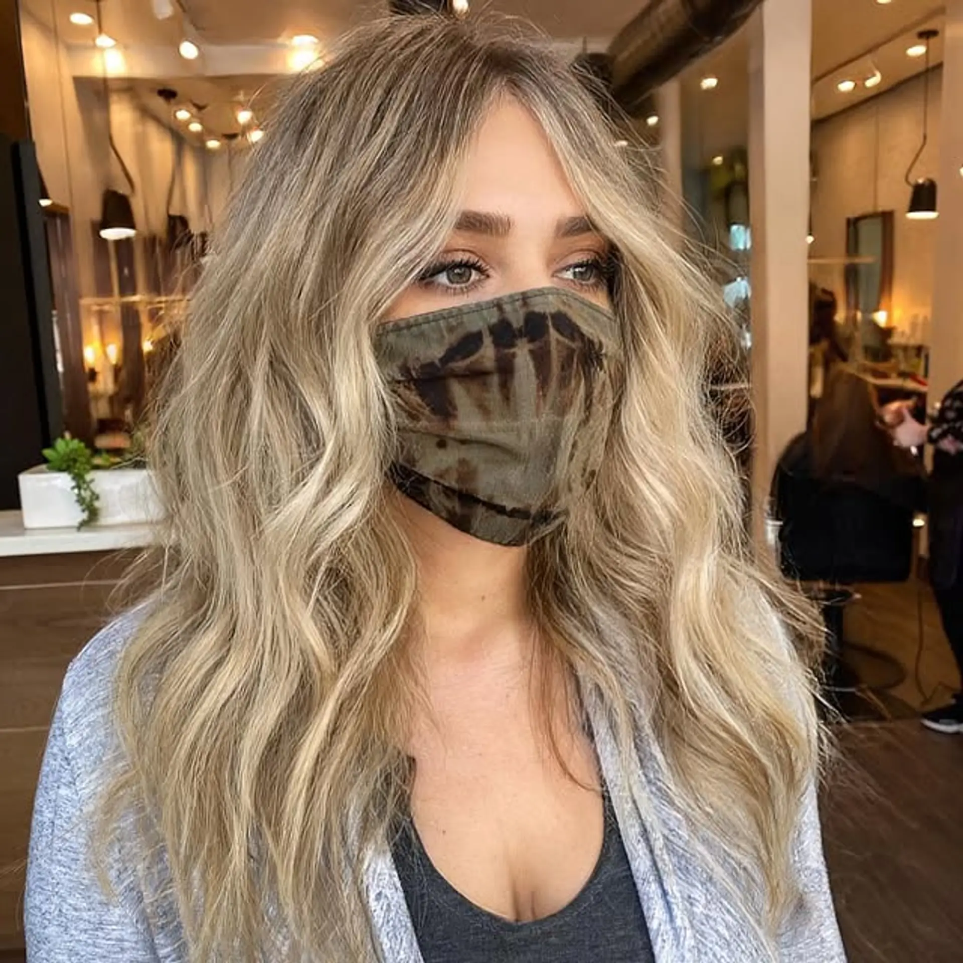 Long, wavy hairstyle with beachy waves and face-framing layers. 1